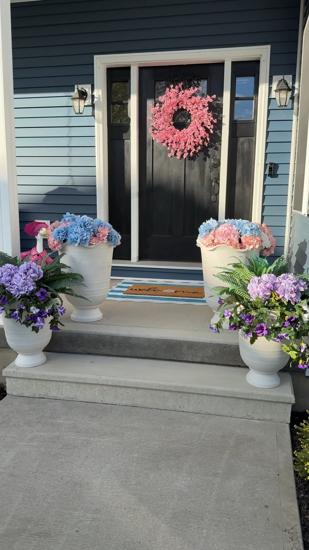There’s nothing I love more than a spring/summer colorful porch! My porch is nowhere near done, but this is what I have so far! All faux florals from Amazon because I can’t keep plants alive 🫠 I bought the two different sized scalloped urns, but honestly, just the larger ones looked gorgeous on their own! 

#LTKHome #LTKSeasonal
