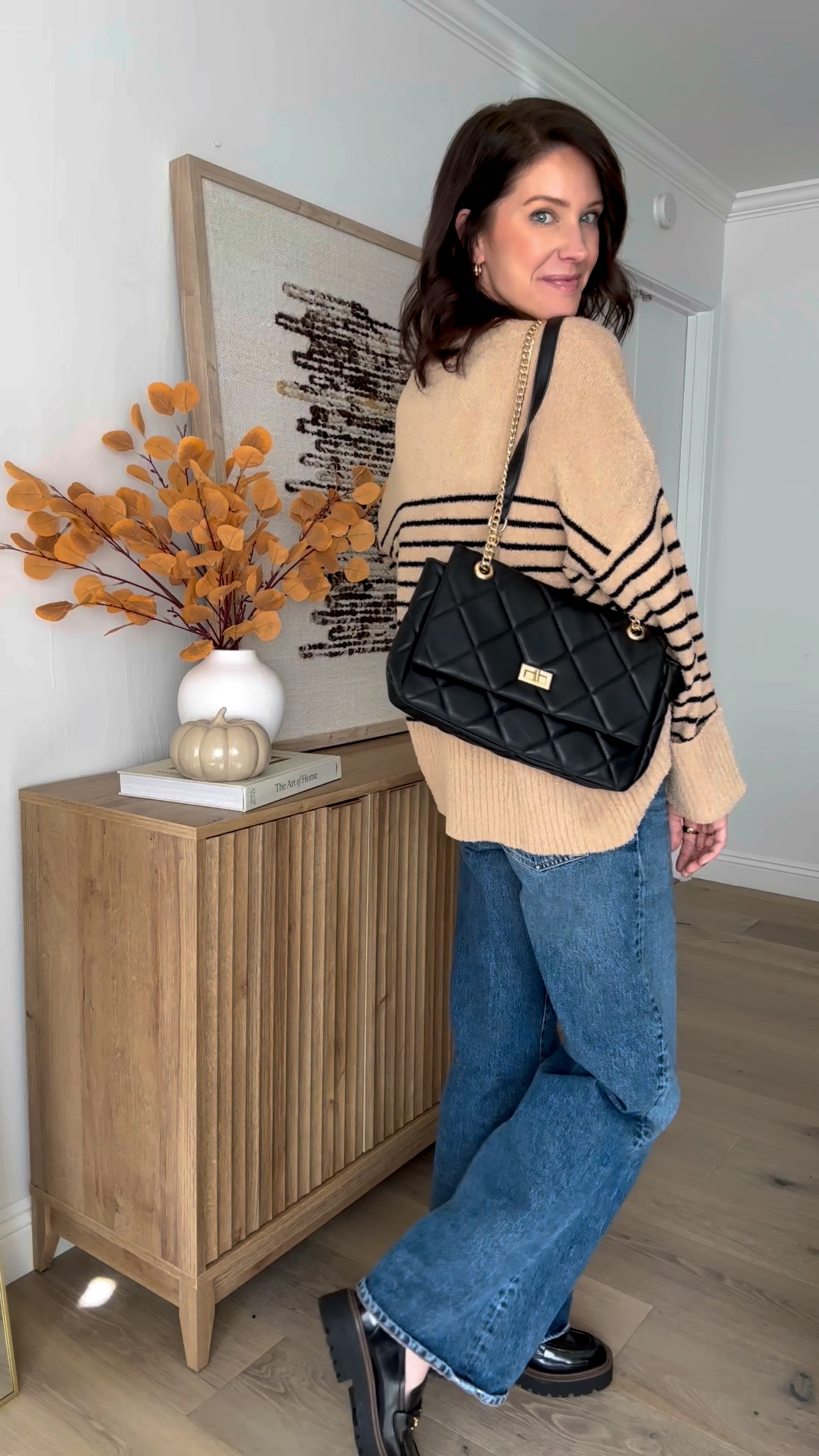 Wearing a small in the oversized sweater. I love the fuzzy material. Jeans are select in sizing available in certain washes. I would say go down a size as they will stretch a bit. Purse is from Italy but I tagged the closest option. This outfit would also be cute with sneakers  