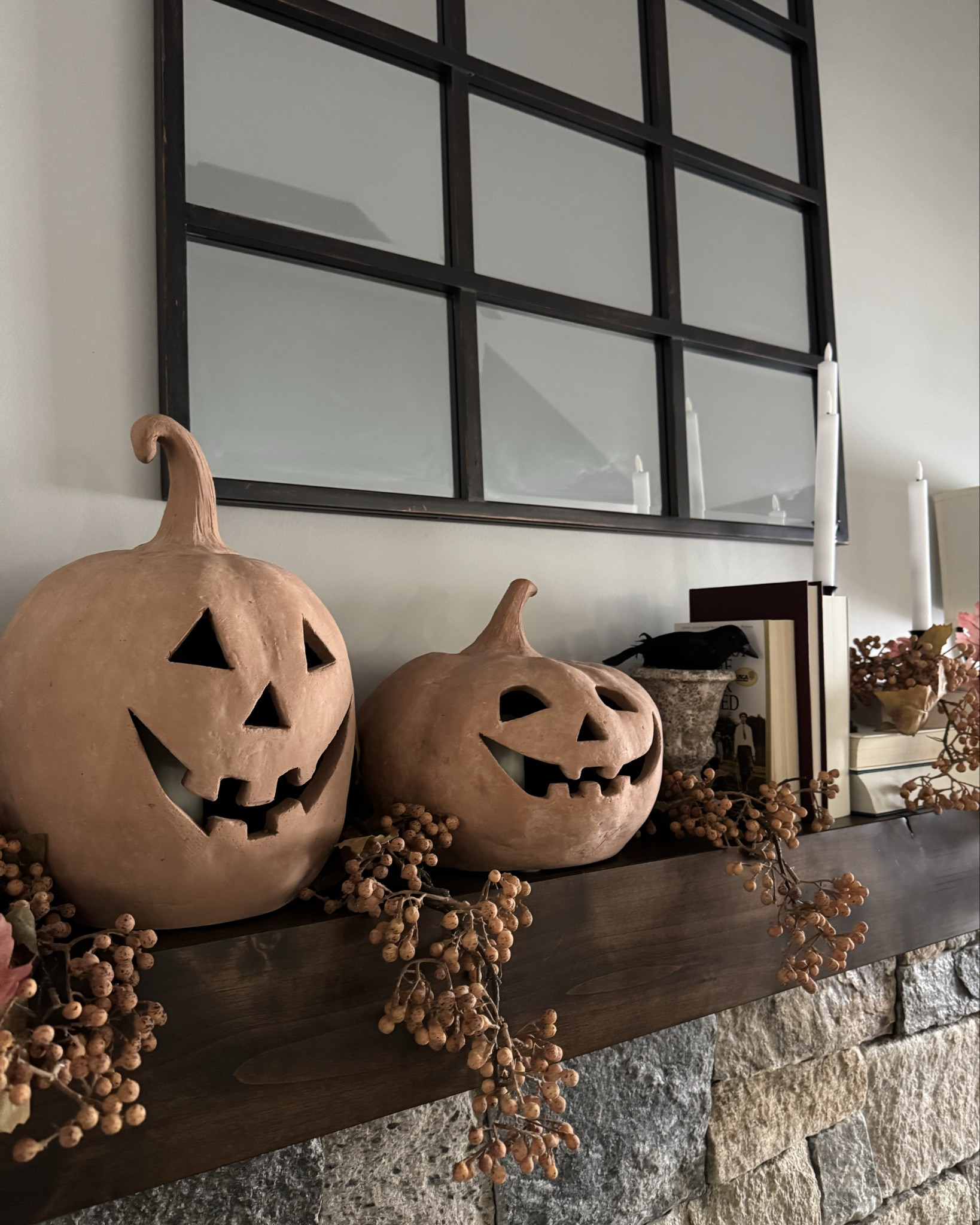 Cozy Halloween Fall Mantel
Pumpkins, floral stems, crows, candles and books create this look! 

#LTKHome #LTKSeasonal #LTKHalloween