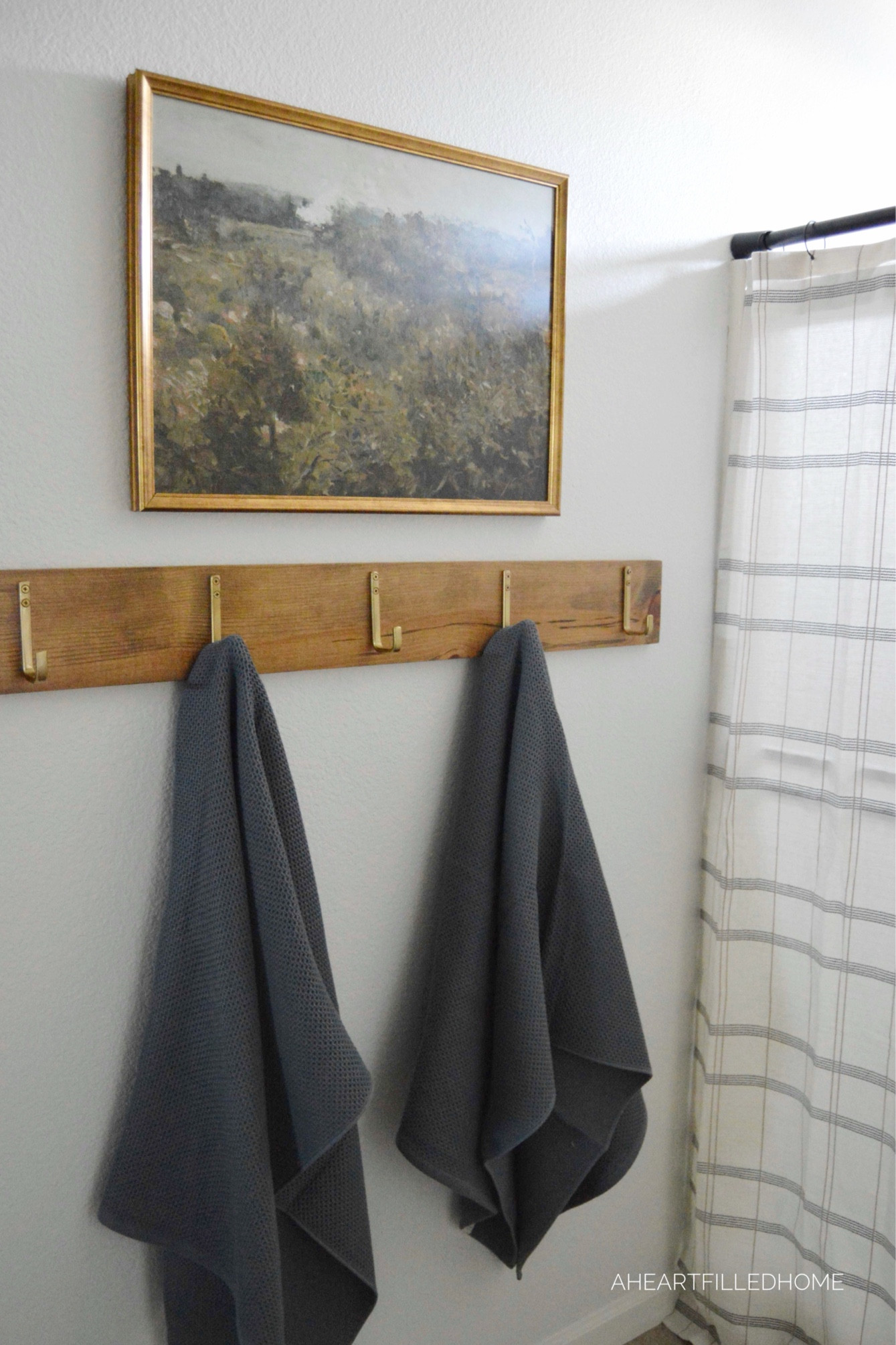 Bathroom makeover including a new shower curtain, hooks, and artwork! 

#LTKfindsunder100 #LTKfindsunder50 #LTKhome