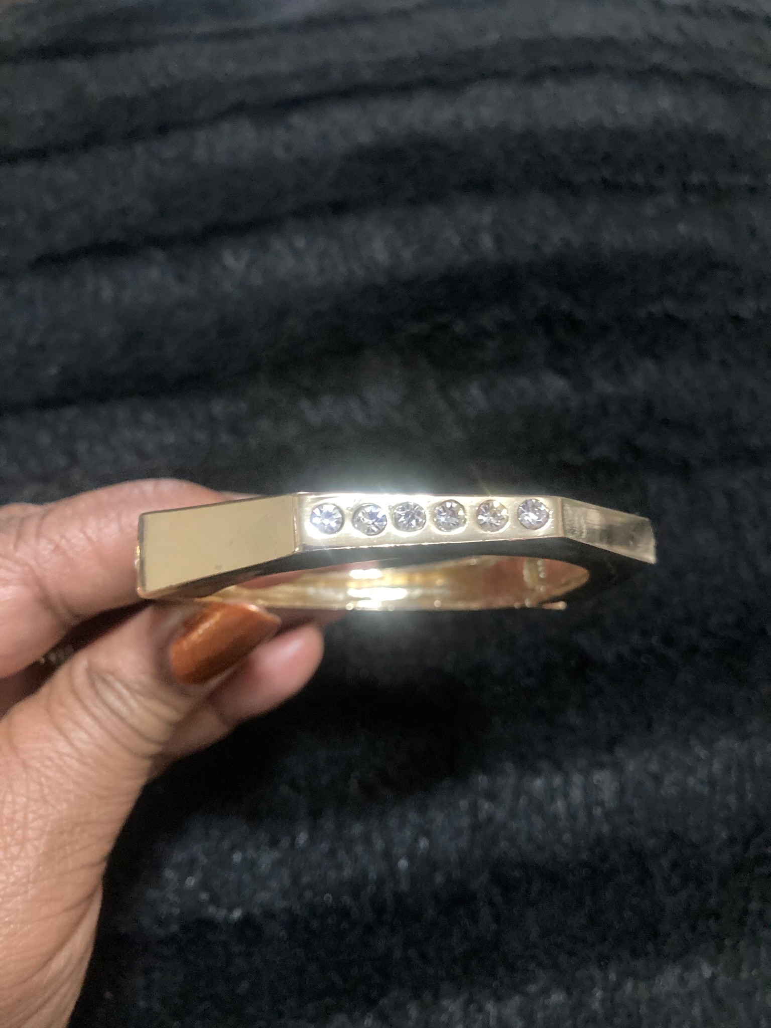 Gold bangle bracelet with cubic zirconia stones.

#LTKBeauty