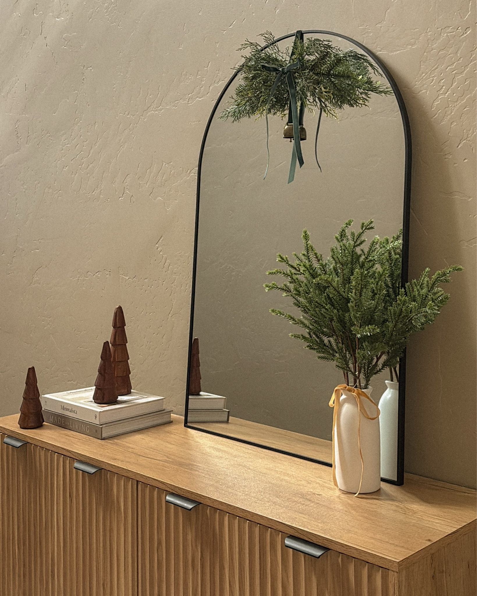 Less is more this Christmas ✨🎄
A simple swag, a few faux greens, and a wooden tree — creating calm, minimal magic on the console table. Effortless, natural, and oh-so-cozy. 🤍

#MinimalChristmas #HolidayStyling #CozyHome #ConsoleDecor #SimpleSeason #WabiSabiChristmas

#LTKHome #LTKSeasonal #LTKHoliday