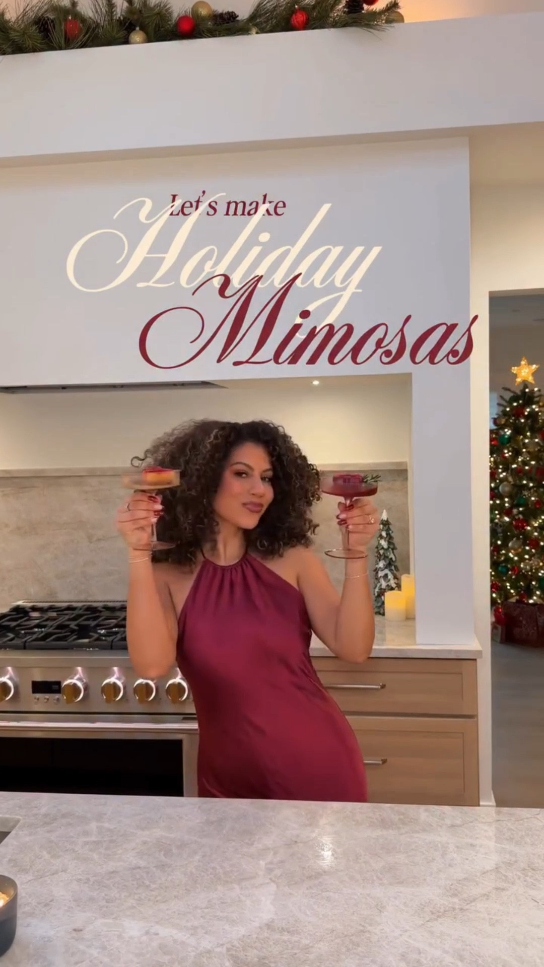 Making some holiday mimosas in our NEW KITCHEN!! 🥰🥂 Should I do a kitchen tour?! 👩🏽‍🍳 Drink recipe down below and comment MIMOSA for the 🔗 to these holiday ice cube molds!

What you’ll need:
- Your juice of choice! I used cranberry & orange 🍊
- Festive ice molds 🎁
- Prosecco or sparkling water for a mocktail 🥂
- Cranberries & rosemary for garnish 🍃

Start by pouring your juice into the ice molds! My ice molds have a bow detail at the top so I poured a small amount of cranberry and let that freeze, then filled it up a few hours later with the OJ to make the bow pop! Add your cranberries into the mold and then freeze. When they’re fully frozen, add them to your glass, pour prosecco into the glass, add a sprig of rosemary and enjoy! 🎁

🇧🇷 Preparando mimosas natalinas na nossa COZINHA NOVA!! 🥰🥂 Devo fazer um tour pela cozinha?! 👩🏽‍🍳 Receita da bebida abaixo e comente MIMOSA para receber o link para essas forminhas de gelo natalinas!

O que você vai precisar:
- Seu suco favorito! Eu usei suco de cranberry e laranja 🍊
- Forminhas de gelo festivas 🎁
- Prosecco ou água com gás para uma versão sem álcool 🥂
- Cranberries e alecrim para decorar 🍃

Comece despejando o suco nas forminhas de gelo! Minhas forminhas têm um detalhe de laço na parte superior, então despejei uma pequena quantidade de suco de cranberry e deixei congelar, depois completei com suco de laranja algumas horas depois para destacar o laço! Adicione as cranberries às forminhas e congele. Quando estiverem completamente congeladas, coloque-as no copo, despeje o prosecco, adicione um raminho de alecrim e aproveite! 🎁

#curlyhair #holidayrecipes #cocktails #cocktailrecipe #christmascocktails