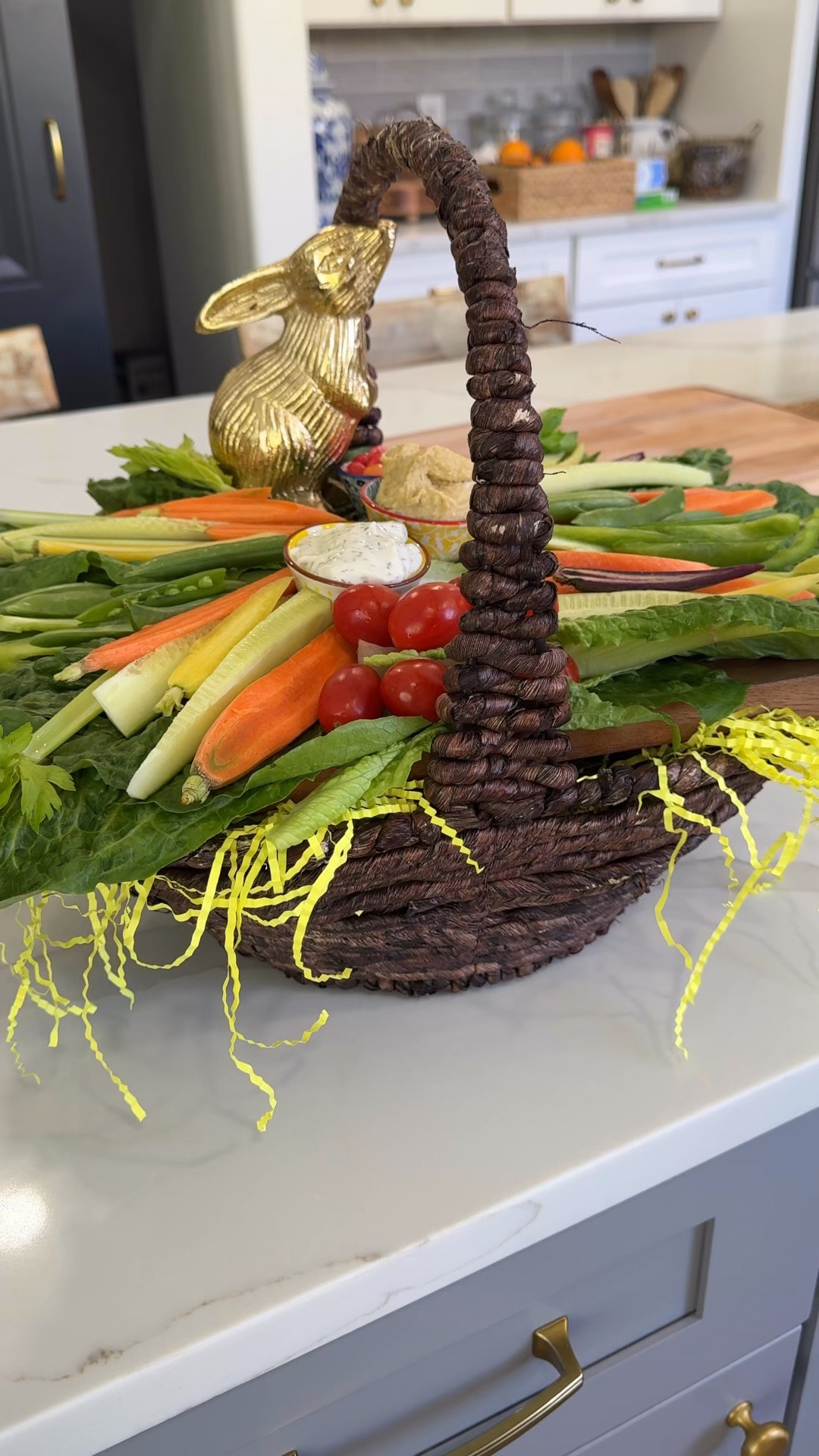 Easter Crudités Board. Start with a basket. Add Easter grass any color. Place a cutting board on top of Easter grass to fit the width and length of basket. Add Romain lettuce to cover board. Cut veggies lengthwise arrange on board. Add 2 dipping bowls fill with your favorite dips. 

#LTKSeasonal #LTKfoodie #LTKvlog