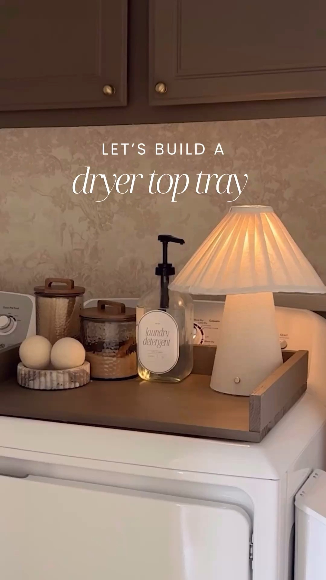 Okay but why was this the hardest thing to find online? 🙃

I wanted a simple dryer top tray — not one of those full washer + dryer spans (because we have a top-loading washer and that just doesn’t work). And everything I found was either the wrong size, wrong style, or way overpriced.
So I made my own.

I used:
+ $9 project panel
+$2 1 x 2 furring strip board
+ Northwood Brown paint by BM in an eggshell finish 

It creates the prettiest little folding surface and keeps things from sliding behind the dryer (which was my biggest annoyance)

Sometimes DIY really is the better option — not just cheaper, but more custom.

Proof you don’t need a huge budget to make your home work better for you 🤍

#DIYHomeProject #LaundryRoomMakeover #BudgetFriendlyDecor #HomeHacks #FunctionalDesign
DIY dryer top tray, laundry room organization, top loading washer solution, small space laundry ideas, budget home upgrades, custom home projects, easy woodworking project, project panel DIY, scrap wood project, affordable home improvements, laundry room styling, practical home solutions, modern farmhouse laundry, neutral home aesthetic, beginner DIY project

#LTKHome