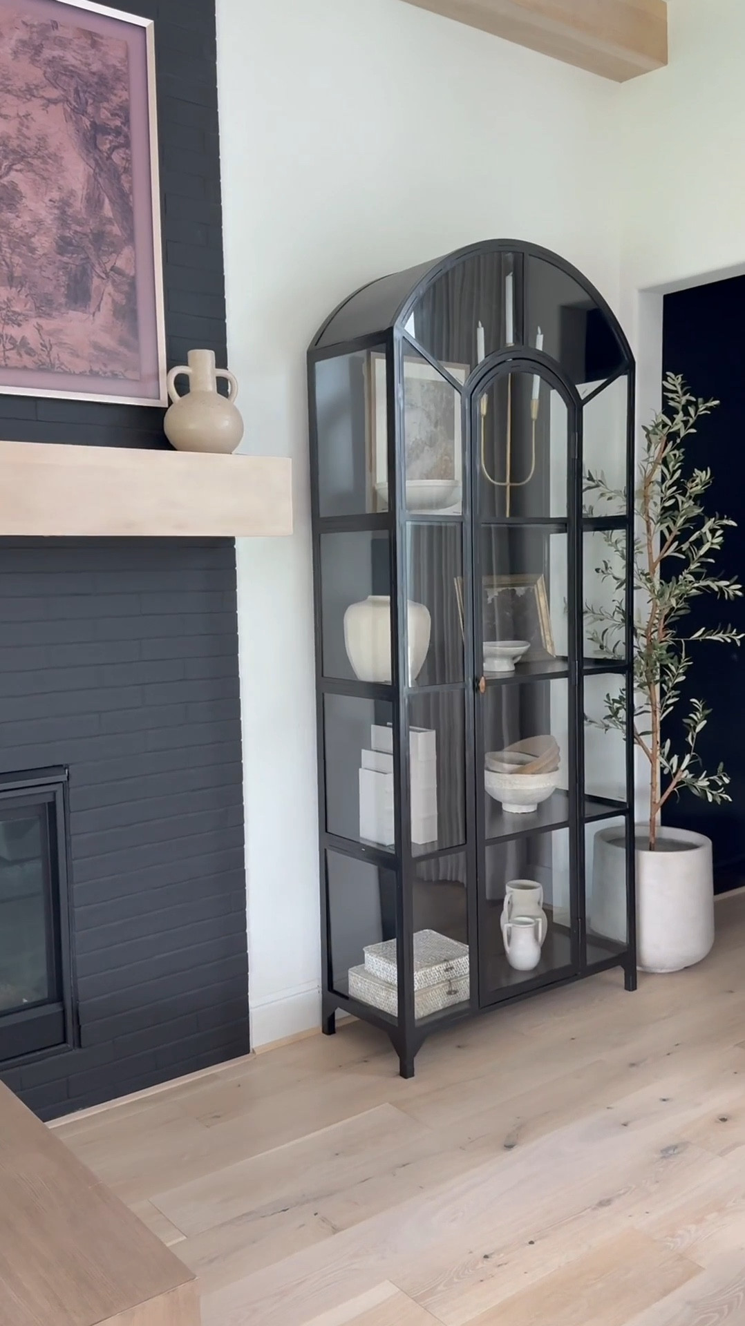 🤎
I've loved this classic cabinet for years plus it's truly a timeless piece that feels heirloom-worthy. ☺️ I love the
arched detail and glass panels that make it look like a work of art.

I now have three in my home! Two in the sitting room and one in the family room — and honestly, l'd add more if I had the space 😬😍

It's perfect for styling any room: dining area, next to a fireplace, bedroom, even an entryway. Solid and sturdy yet surprisingly easy to move. I love filling mine with neutral decor and adding a subtle pop of gold for warmth and contrast. A forever favorite 🖤

👉 I’ve linked the exact product plus similar options for easy purchase!

#LTKHome #TimelessDesign #HeirloomQuality #HomeDecorFinds #ClassicStyle #InteriorInspo

#LTKSaleAlert #LTKHome