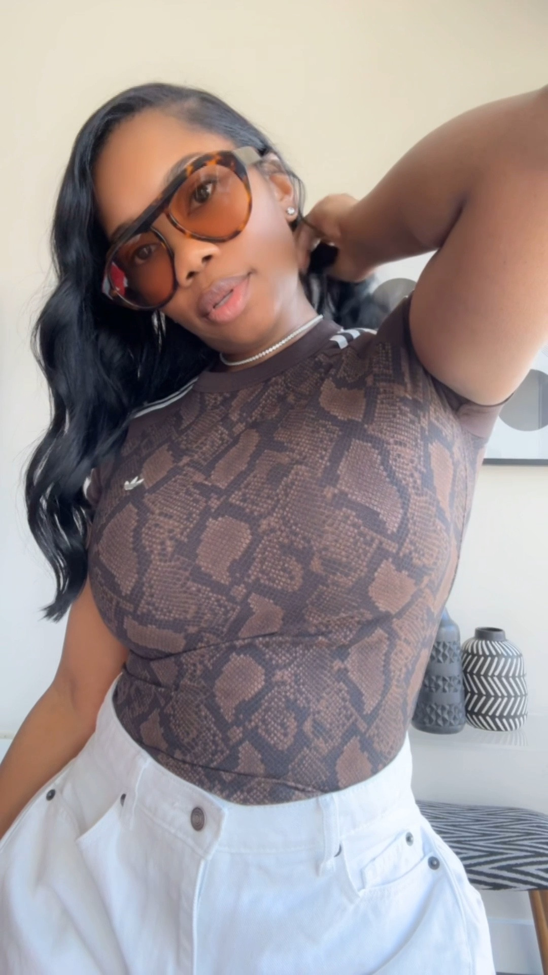 This snake print @adidas top is so versatile. I have it styled with my adidas satin snake print wide leg pants as well as with white denim Bermuda shorts to bring out the white stripes. I’m wearing a size S in the top, M in adidas pants and a size 6 in the shorts. 

#summeroutfit #adidasoutfit #ltkstyle 
#outfitinspo

#LTKootd