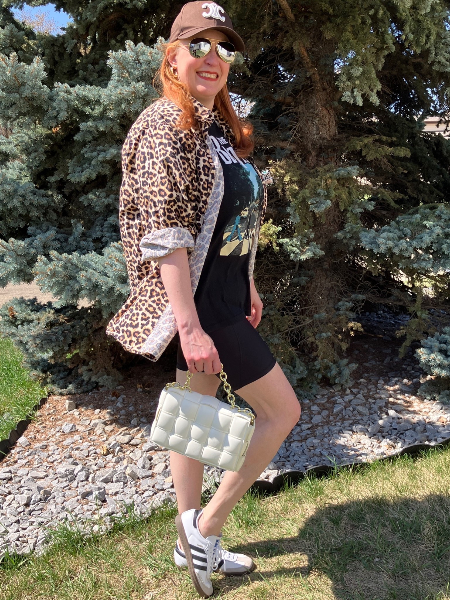 I think I’m in trouble! Tim (my husband) gets out of the hospital tomorrow and I need to become a nurse for him because of his broken leg. In the meantime I had to bring back my leopard shirt and style it in a new way. Some spandex shorts, a graphic T, baseball cap, sunnies, a cool bag, and Addidas sneakers and I feel like I’m back in the 80’s! Such an easy look for summer when you’re not sure what to wear. I could be getting groceries or heading to the gym - but probably not! 😂 Canadians click on the first links to shop, and Americans click on the second links to shop. If there’s only one link then you can shop it in your own country. And remember, trendy doesn’t have to be expensive! Bye!

#LTKsummer #LTKmidsize #LTKover50style