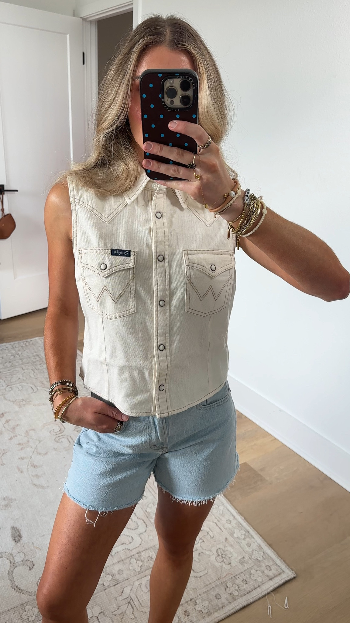 @Wrangler size small Your favorite Western style—reimagined to beat the summer heat. Our Women’s Sleeveless Denim Snap Shirt captures everything you love about the iconic cowgirl staple, now with a cropped and sleeveless silhouette for sun‑soaked days. It keeps the authentic details front and center: single-point yokes, chest flap pockets with the signature stitching, and pearl snaps that pull the whole look together. Crafted from 100% cotton denim, it’s built to keep you comfortable from that first sip of coffee to golden‑hour adventures.

#LTKSeasonal #LTKootd #LTKFestival