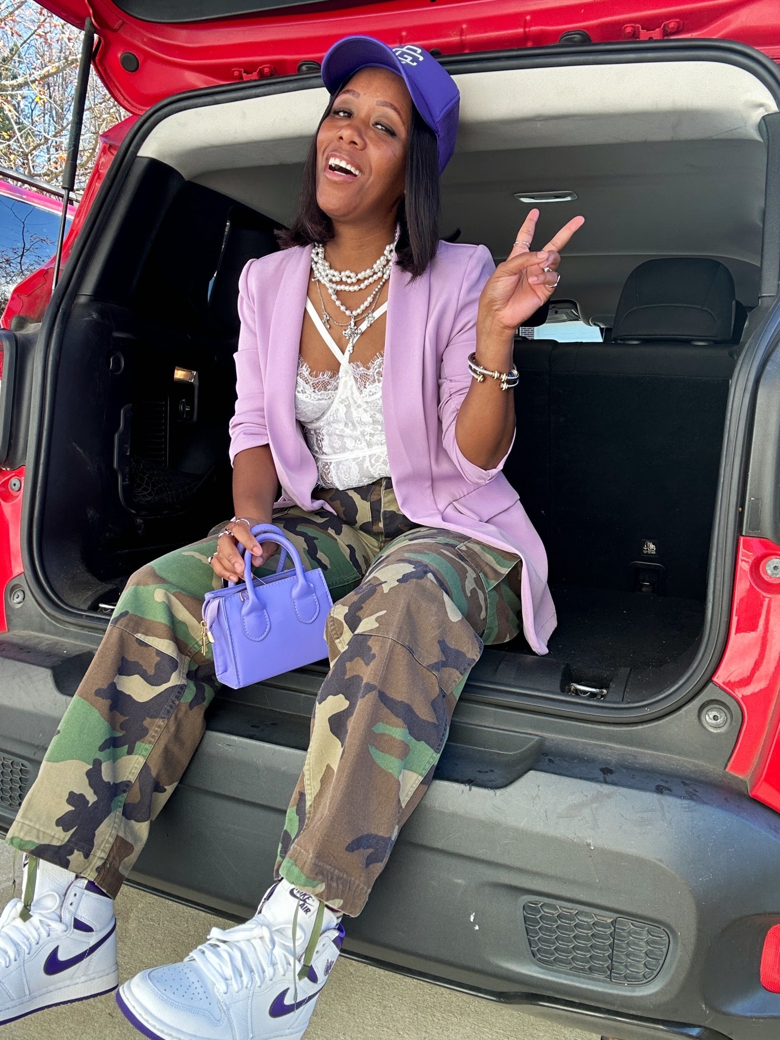 Loving how i style these camo cargo pants with a white lace bodysuit, purple blazer, purple trucker hat, purple purse, and purple and white sneakers 

#LTKFindsUnder50 #LTKootd #LTKPetite