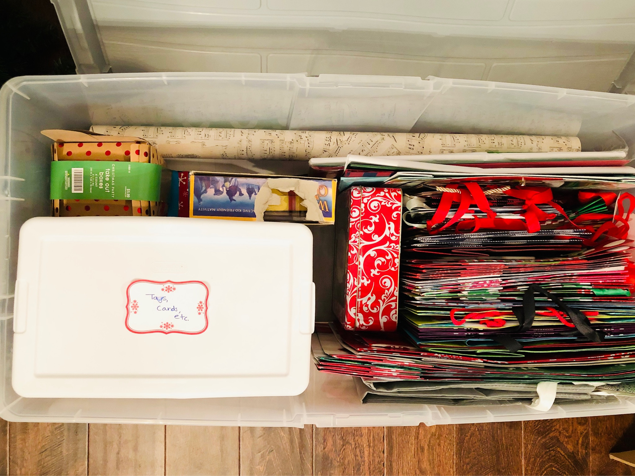 All the holiday gift wrap in one place! Wrap it paper, bows, tags and bags all stored and organized in one container. Your gift wrap station in a portable, inexpensive container. #walmartorganization #targetorganization #budgetorganization #giftwraporganization

#LTKSeasonal #LTKHoliday #LTKhome