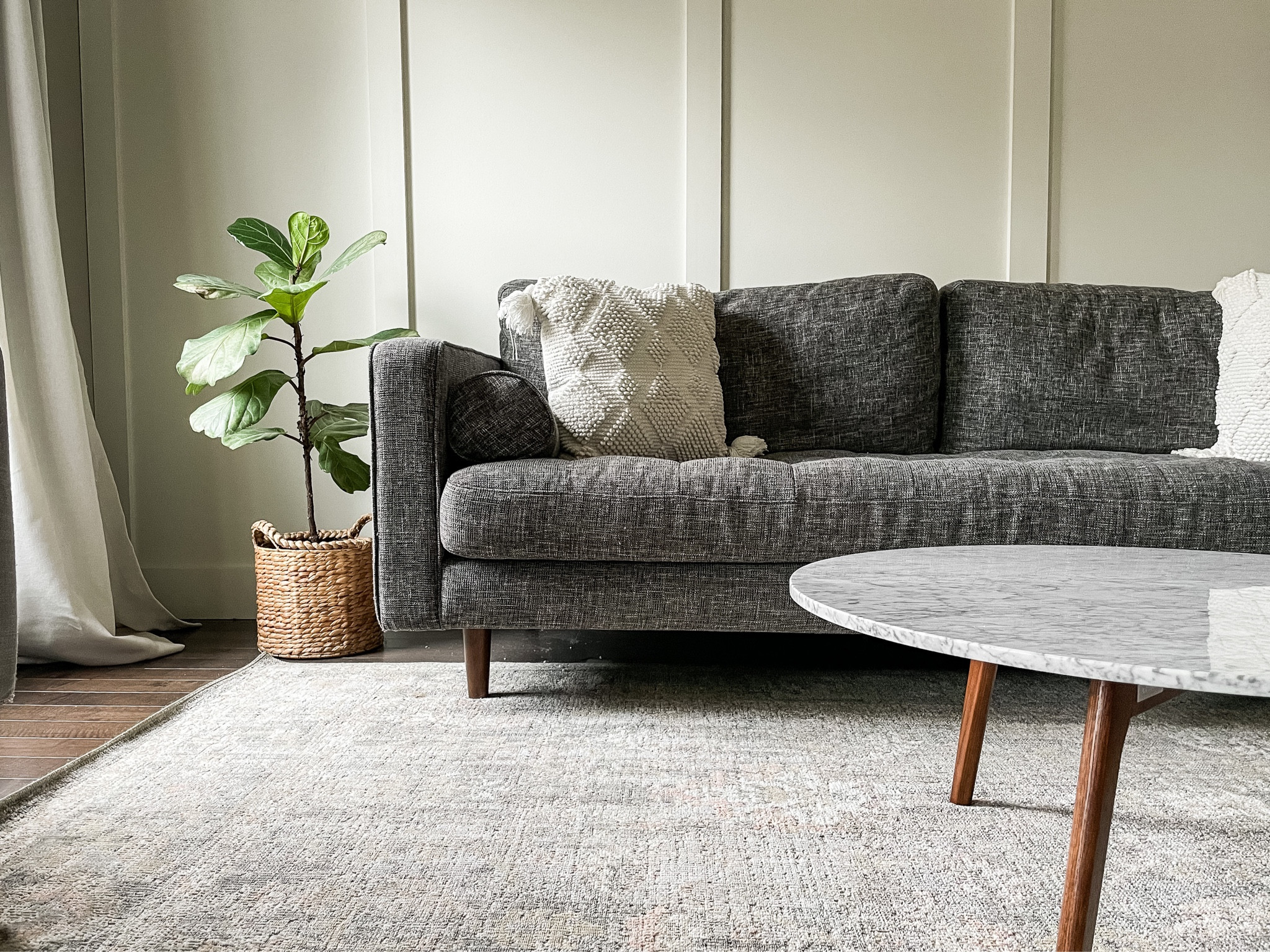 Living room midcentury furniture.  Rosemarie Sage/blush 7 X 10 Loloi with Chris Loves Julia area rug.  Living room view.  Cozy minimalist modern design.  Living room design.  Midcentury furniture.   Loloi vintage area rug by Chris loves Julia.  Marble top midcentury coffee table.  Target home decor.  Neutral home decor.  Modern gray sofa.   Linen curtains.  Target blockout curtains.  


#LTKhome #LTKfamily