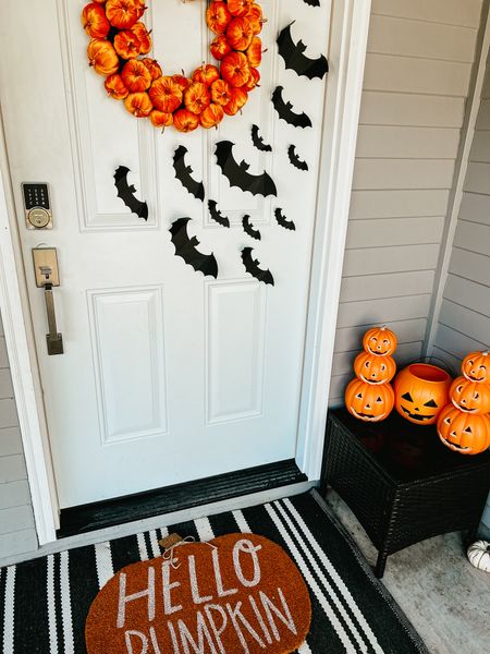 Slowly starting to decorate our front porch for Halloween. Velvet pumpkin wreath is Tj Maxx find, bats from Walmart and stacked pumpkins from Target. Stripe black and white outdoor rug is from Target and Hello Pumpkin door mat is Mud Pie. 

#halloween #decor #frontporch #spooky #doormat #velvet #orange #black #target #tjmaxx #mudpie 

#LTKSeasonal #LTKHalloween #LTKhome