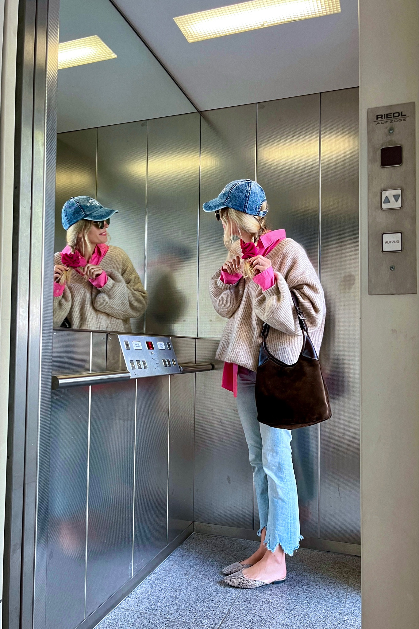 Denim Cap. Fashion Blogger Girl by Style Blog Heartfelt Hunt. Girl with blond hair wearing a denim cap, pink shirt, chunky sweater, vintage Prada bag, favorite denim pants, snake print mules. #pinkshirt #denimcap #scrunchiestyle #pinklook #colorfuloutfit #colorfulstyle #colorfulfashion #colorfullooks #fashionfun #cutefalloutfit #fallfashion2023 #falllookbook #fitcheck #dailylooks #dailylookbook #contentcreator #microinfluencer #discoverunder20k