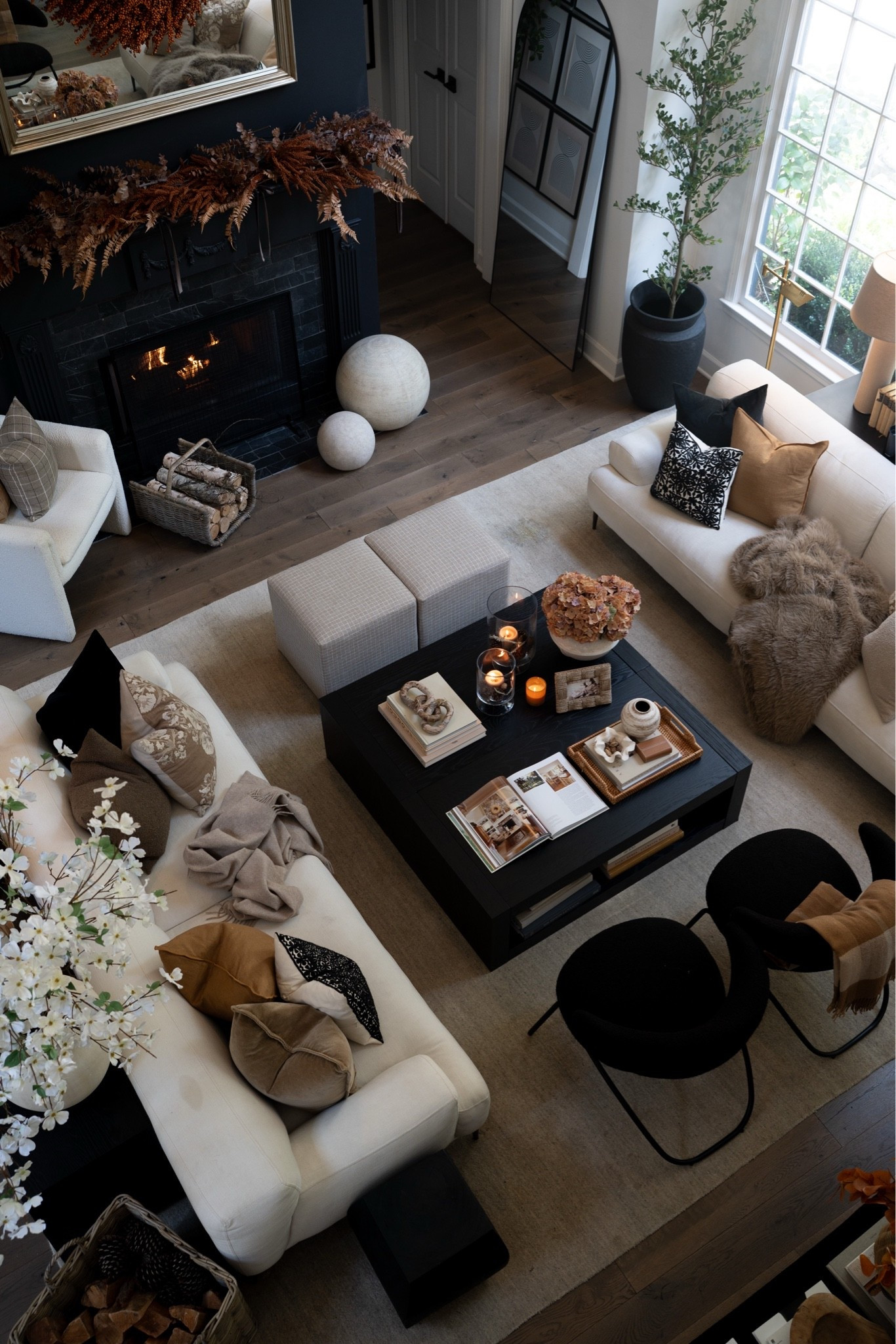 The real magic of fall is in the little details… the lighting, the warm wood coffee tables (from Amazon!) and the fluffy pillows, the candle light, and the fire going!