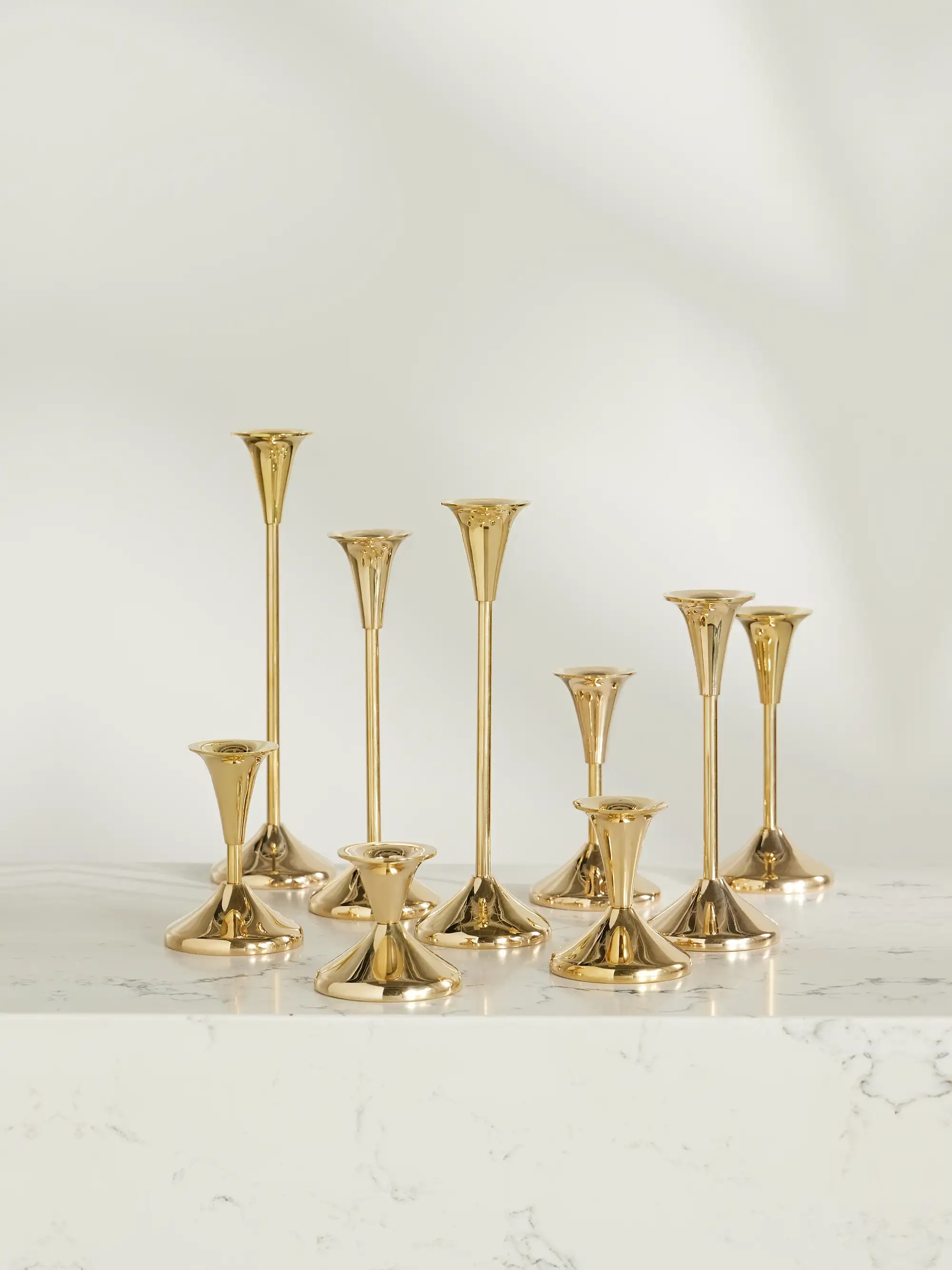 Puddle set of nine brass candlesticks | NET-A-PORTER (US)