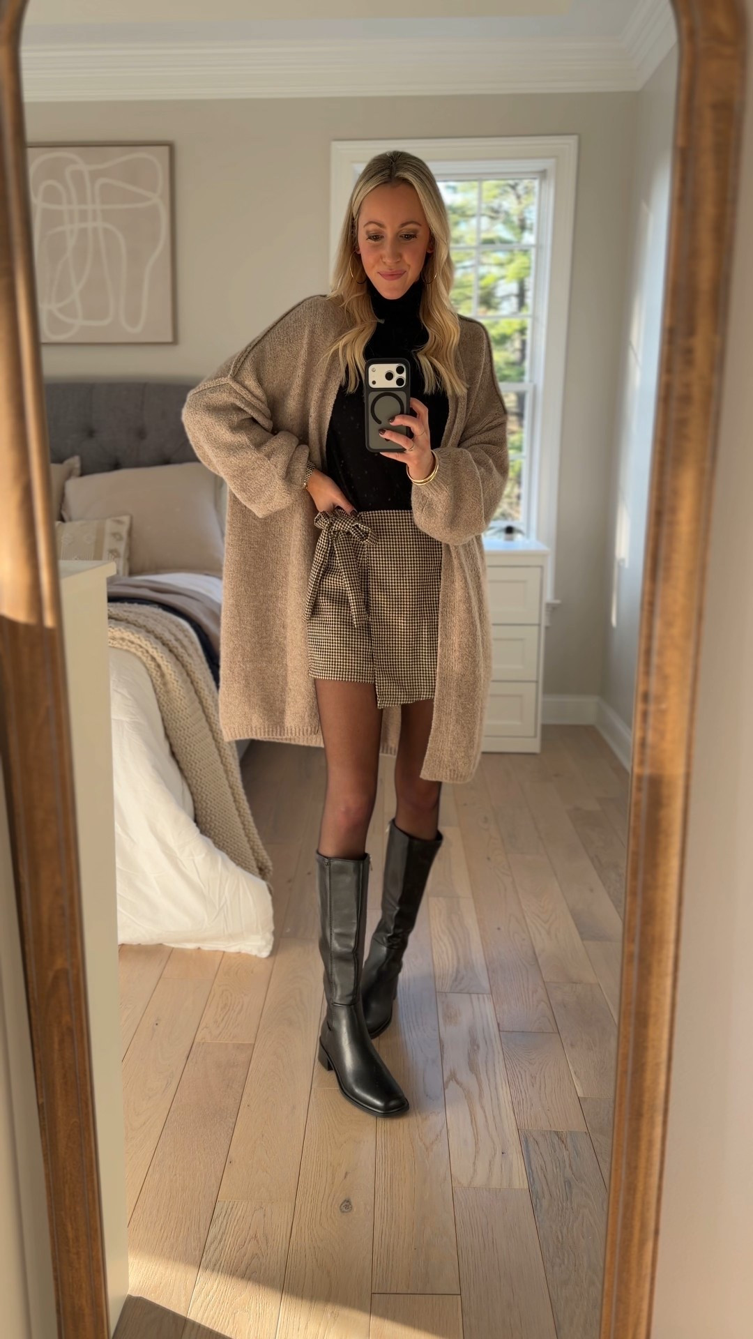 Thanksgiving outfit idea!  Love this plaid wrap skort! And this lightweight turtleneck long sleeve and this oversized long length cardigan have been go-to layers for me lately! Love these black knee high boots, too! 

#LTKHoliday #LTKWorkwear #LTKFindsUnder50