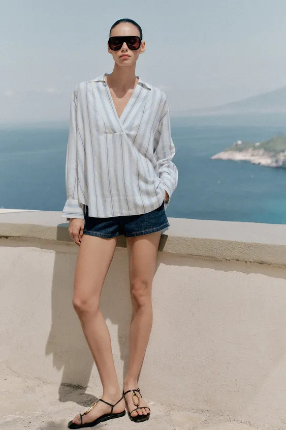 Bluse aus Viskosemischung mit 24 % Leinen und 5 % Lyocell. Polokragen und lange Ärmel. | Zara DE