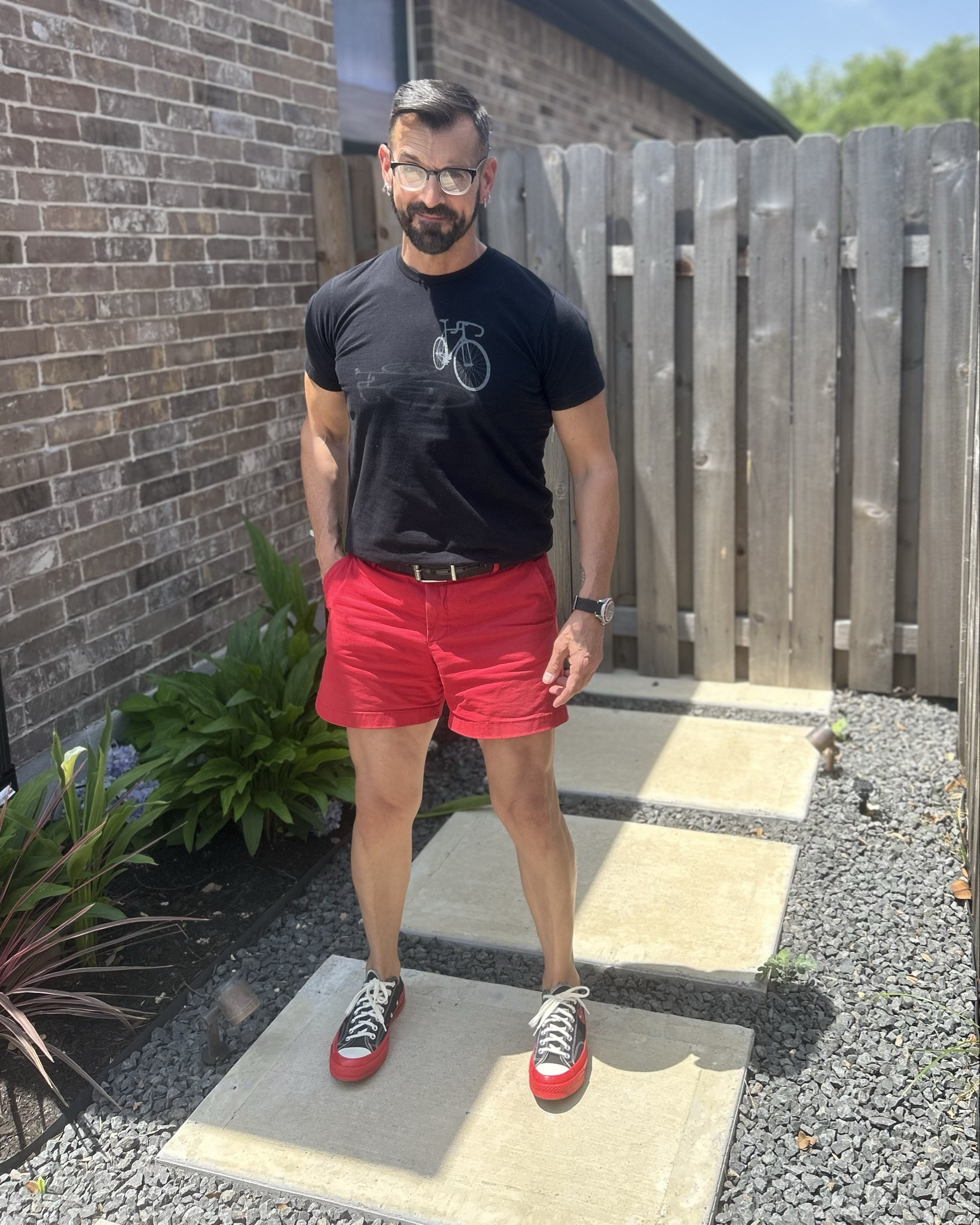 As per my story the other day…

Let’s break down my outfit and talk about why the shorter shorts are not just working, but are the correct choice.

🔥 Fit Analysis
	•	T-Shirt:
A clean, fitted black tee with a subtle graphic—simple but effective. It hugs the chest and arms just right, highlighting my physique without being flashy.
	•	Red Shorts:
Let’s just say it—you may not like hearing it, but this is the correct length of shorts for a man. Set decades ago by the legendary Tom Selleck in Magnum P.I., the bar was high back in the ’80s. These aren’t just red shorts—they’re a bold statement. 
	•	Shoes:
A black-and-red sneaker combo ties everything together, keeping things casual, cohesive, and cool. They echo both the tee and shorts without feeling too matchy.
	•	Accessories:
A clean watch, classic belt, and frames bring in intentional detail. Jewelry subtly finishes things off with a touch of personality. These extras say, “Yes, I thought this through.”

🩳 Let’s Talk Shorts

Men, can we PLEASE stop wearing knee-length (or longer), baggy cargo shorts? Honestly—they were never “in style”. Oof. Time to let those go. Let the go-sticks get some sun!

Shorter, tailored shorts:
	•	Show off your legs and give your outfit proportion.
	•	Highlight an athletic frame.
	•	Give off a modern, fashion-forward (with a touch of retro) vibe.

This look is clean, bold, and speaks volumes without shouting. Nailing that fine balance between relaxed and refined. It’s not just about fashion—it’s about owning it. Yes, this is my “vibe”

Want to build more looks around this formula? I’d be happy to help you expand the rotation.

#LTKMens #LTKSeasonal #LTKOver40