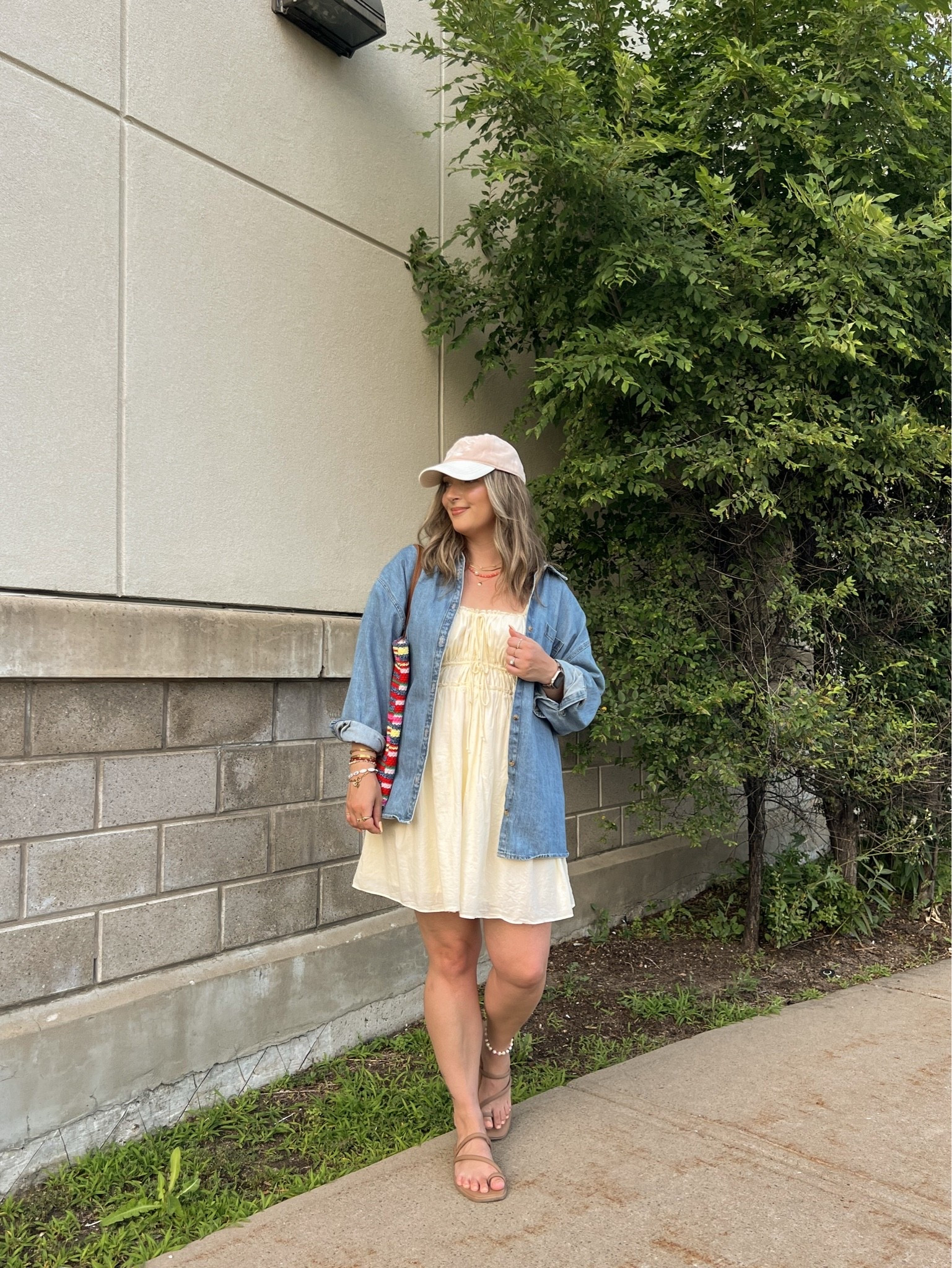Easy summer outfit! My butter yellow dress is old from aerie, but I linked a super similar option! Wearing my usual size L in the denim shirt. Crocs sandals are super comfy, I’m a 9.5-10 shoe and wear a 10. Canadian shirt, sandals, and bag links are under “similar products”

#LTKsummer #LTKmidsize #LTKdresses