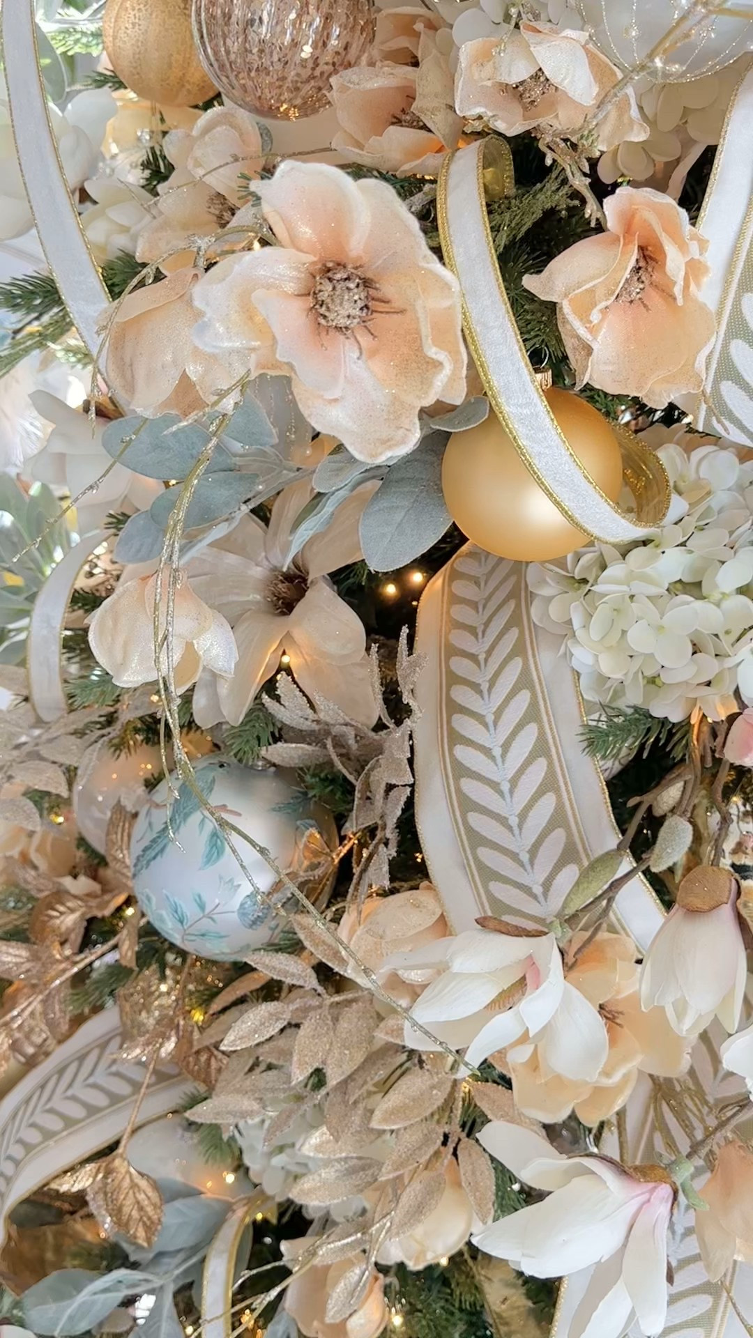 A winter garden Christmas tree decor 🌸🍃🕊️✨ I attached the fabric trim directly on top of the wired ribbon using a micro tagger but you can also use hot glue 