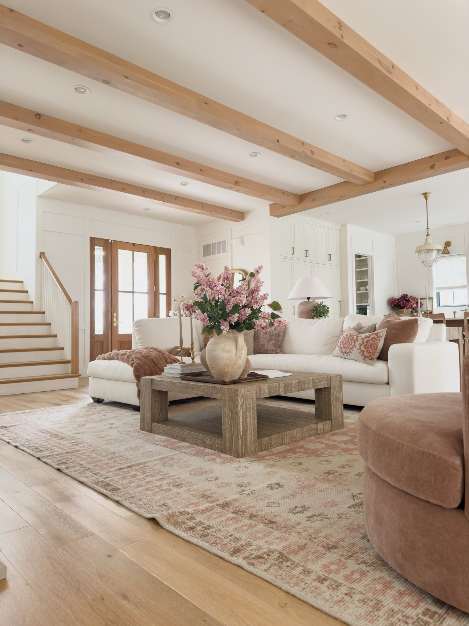 Spring living room reveal showcasing this stunning oversized square coffee table. This has easily become one of my favorite furniture pieces and the quality is amazing 

Spring living room reveal, home refresh, light and bright, creamy whites, natural wood tones, pops of pink, square coffee table, neutral area rug, open concept living, accent chair, sectional faves, wooden furniture, Pottery Barn style, coffee table decor, faux spring florals, vase faves, decor books, gold detail, Amazon Prime, found it on Amazon, shop the look!

#LTKSeasonal #LTKstyletip #LTKhome