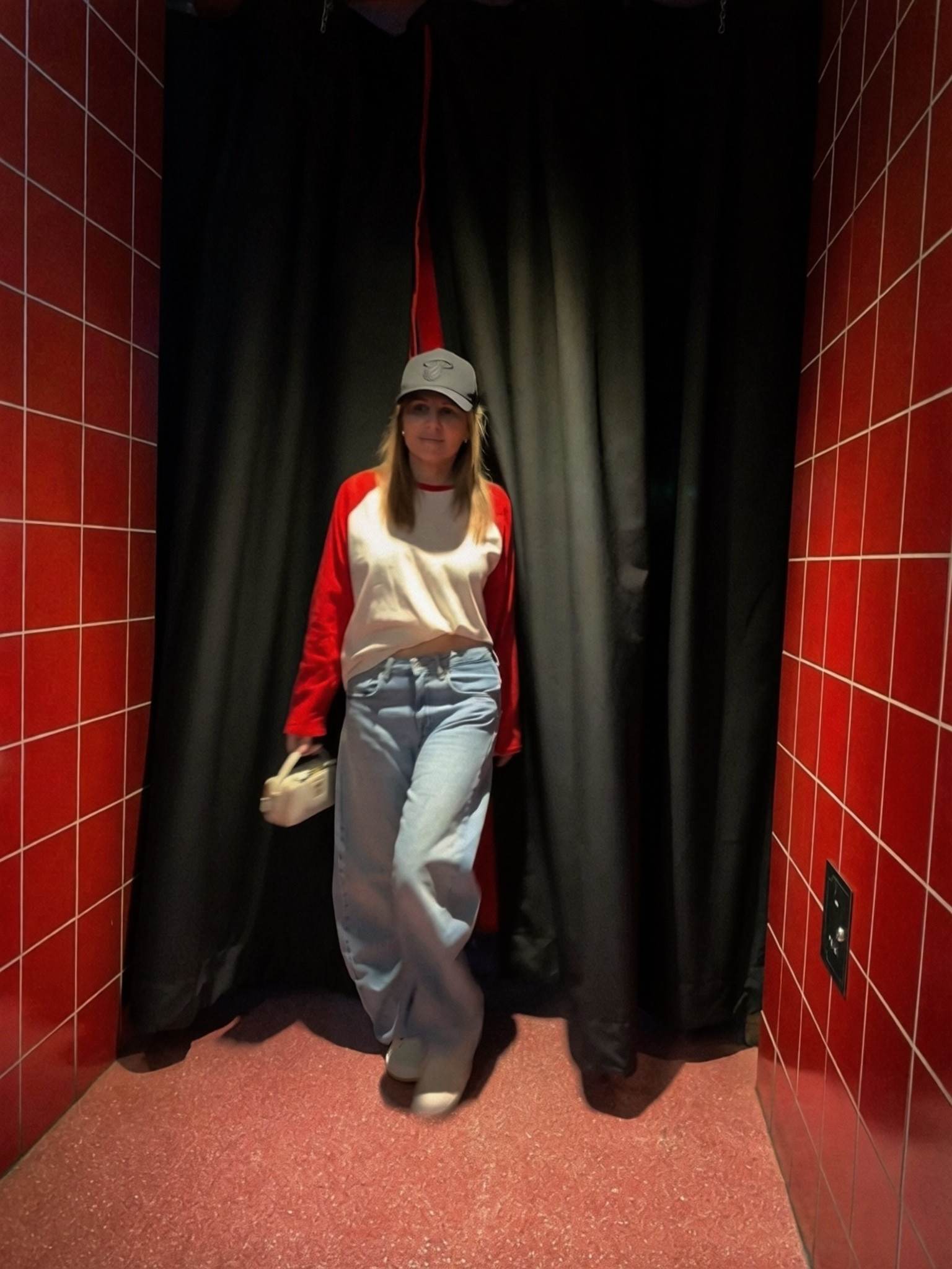 Last Heat home game of the season 😢 but snapped this pic of my outfit. Wearing a 3/4 sleeve red and white raglan baseball jersey shirt w loose fit low rise light wash jeans, black Miami Heat hat and my white on white Jordans. 

#LTKActive #LTKootd #LTKSeasonal