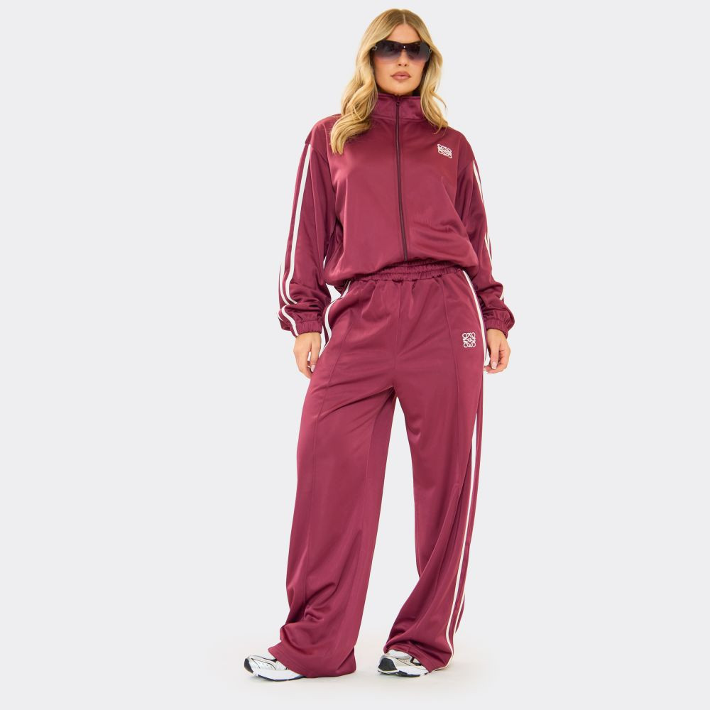 Contrast Stripe Embroidered Swirl Logo Track Pants In Burgundy | EGO (UK)