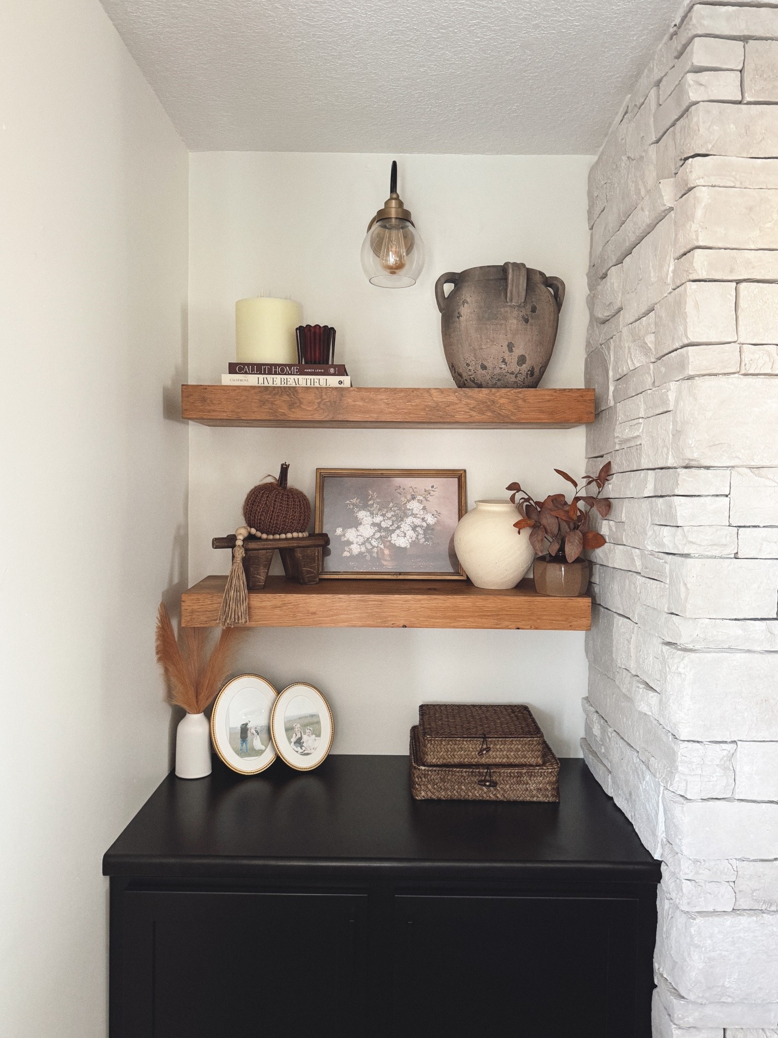 Cozy shelf styling 🍂 I love mixing books, art, baskets, and ceramics to create shelves that feel layered but not cluttered. Neutral textures with just a touch of warmth make this space feel so inviting.

#ltkhome #shelfdecor #cozyhome #neutraldecor #homestyling #fallhomedecor
