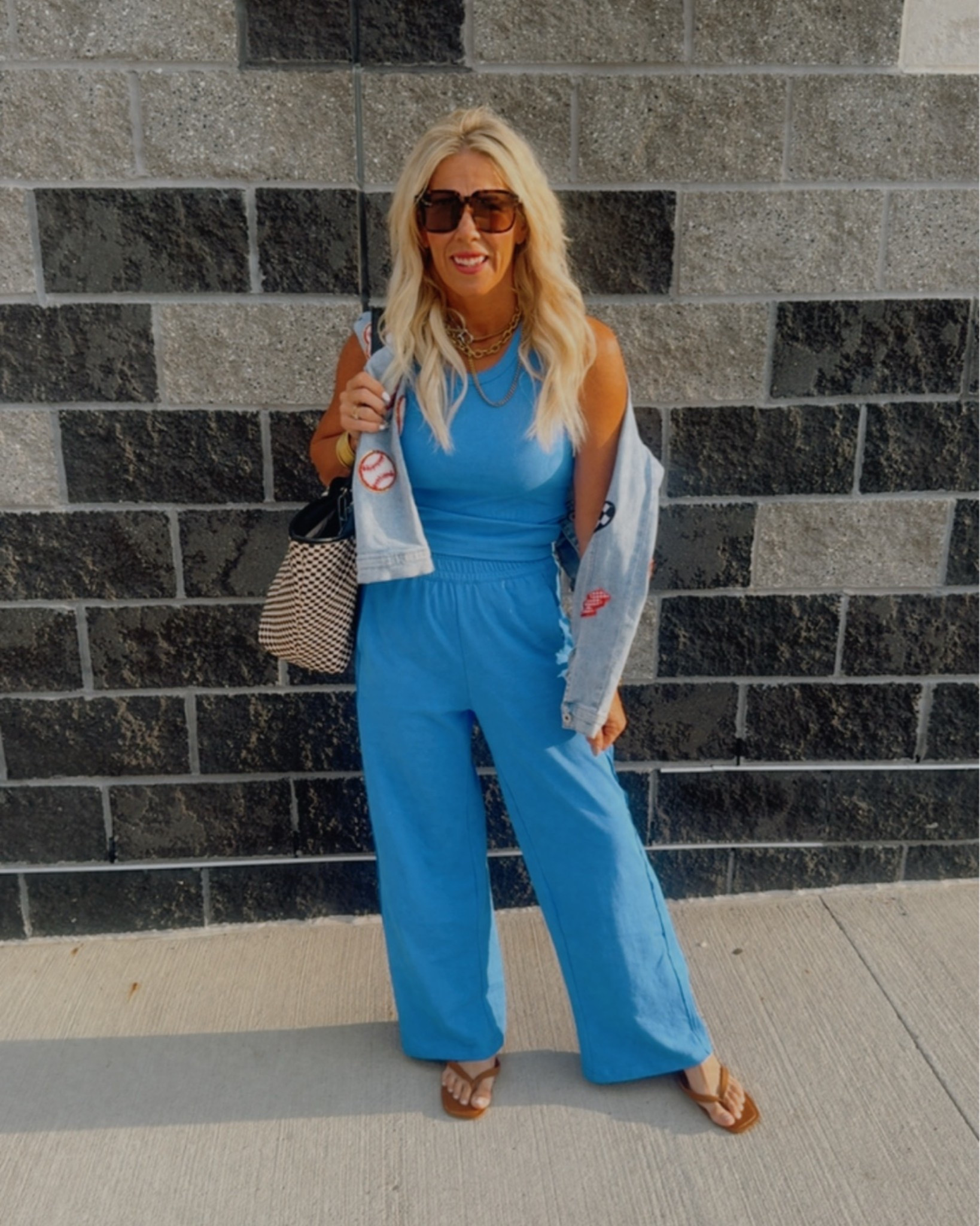 Okay, you guys—if you’re looking for an outfit you can wear on repeat and get compliments the second you walk into the ballfield, this is it! 🩵🧡

Our team colors are Carolina blue and orange, so this look is perfect for both football and baseball season. I had an 8 a.m. game, and I loved that I didn’t even have to think about what to wear—it’s so freaking comfortable!

The ribbed tank is amazing. I’m normally a small, but I sized up to a medium for a little extra length and a more relaxed fit. I’m wearing a small in the pants, and they’re super comfortable too. I threw on a denim jacket, and it instantly completed the entire outfit.

Cute, comfortable, and zero effort—the perfect ballfield mom look! ⚾️🏈✨

#LTKootd #LTKgrwm #LTKmomlife