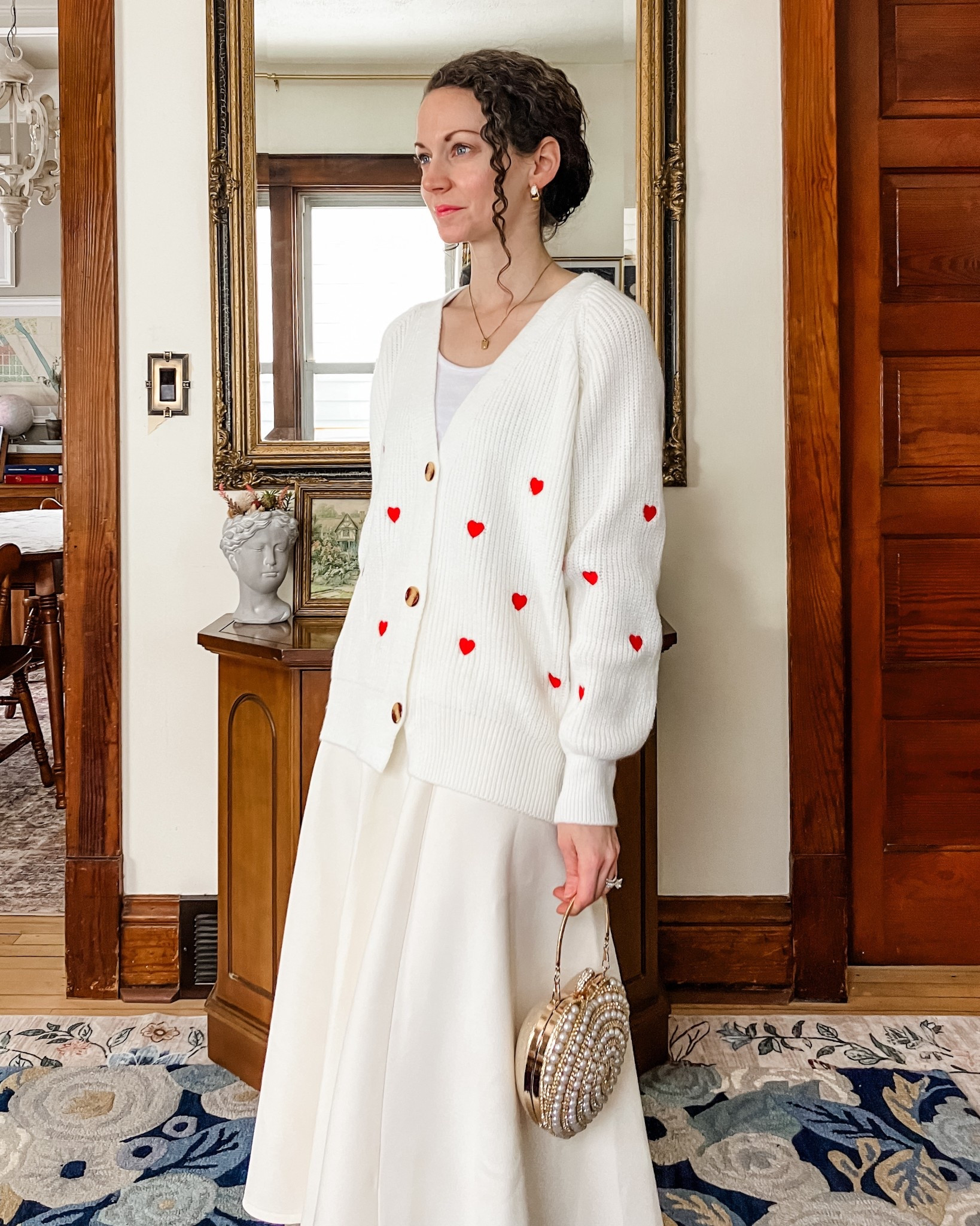 A modest Valentine’s Day outfit!
White and red embroidered heart cardigan from Chicwish. 
White cropped tank top from Amazon. 
White skirt from Chicwish. 
Jeweled heart bag from Chicwish. 
Gold and white topaz earrings from Peachmind. 
Gold and diamond necklace from Oak and Luna. 
Petite outfit. Neutral outfit. Modest outfit. Valentine’s Day outfit.  

#LTKootd #LTKOver40 #LTKValentine