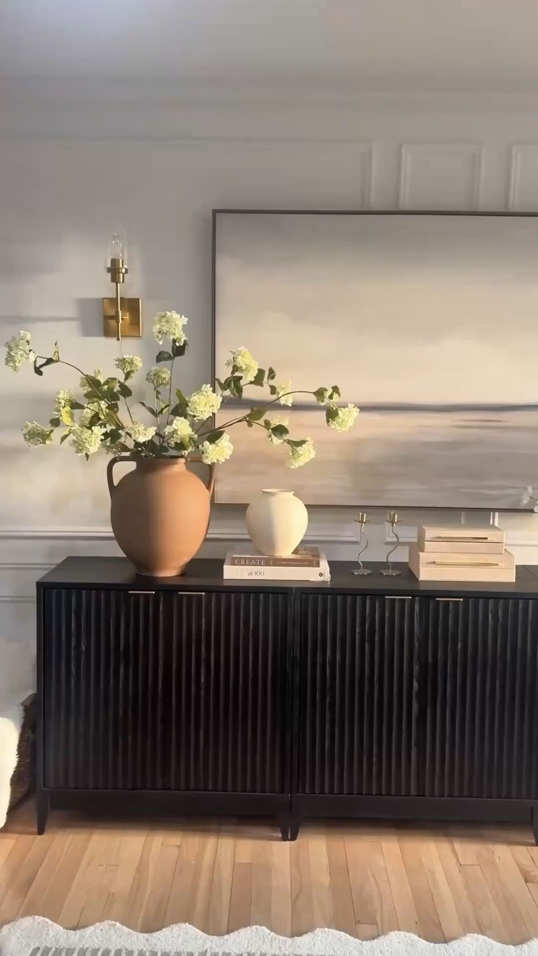 had to share a closer look at this dreamy combo because I’m still obsessed with how it turned out 🤎✨

this fluted cabinet paired with the oversized artwork gives the entryway such a cozy, elevated feel while still keeping everything soft and minimal. I actually styled three of the cabinets side by side to create the perfect length for our space and it completely transformed the whole area. 🌿

it’s one of those setups that feels custom, high-end, and designer-inspired without being overly complicated and I honestly couldn’t love it more.

the cabinet is currently on sale and the artwork just came back in stock, so I linked everything while it’s still available ✨

#LTKHome #LTKSaleAlert #entrywaydecor #modernorganic #neutralhome #designerlookforless

#LTKdayinmylife #LTKHome #LTKmomlife