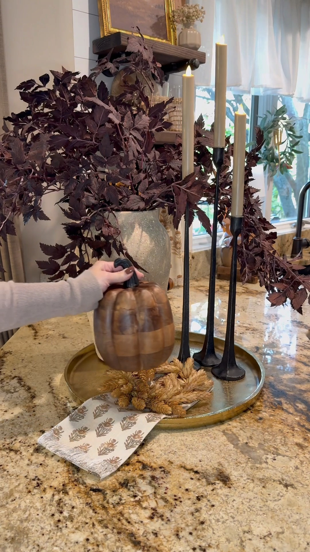 Warm & Moody Fall Styling for the Kitchen Countertop
Follow @farmtotablecreations on Instagram for more seasonal home inspiration 🤎

This cozy fall vignette adds the perfect touch of seasonal charm to the kitchen. I styled a neutral round tray with deep plum stems for contrast, sleek black candlesticks with flameless taper candles for ambiance, and a rich wood-look pumpkin for that layered organic warmth. I also love tucking in a hops  candle ring  and folded autumn napkin for a curated, collected feel.



#fallkitchendecor #fallstyling #amazonhomefinds #targethome #walmarthome #falltraydecor #fallpumpkindecor #candlestickstyling #kitchencounterdecor #flamelesscandles #moodyfall #amazonstems #ltkfall #kitchendecorideas

#LTKHome #LTKSaleAlert #LTKSeasonal