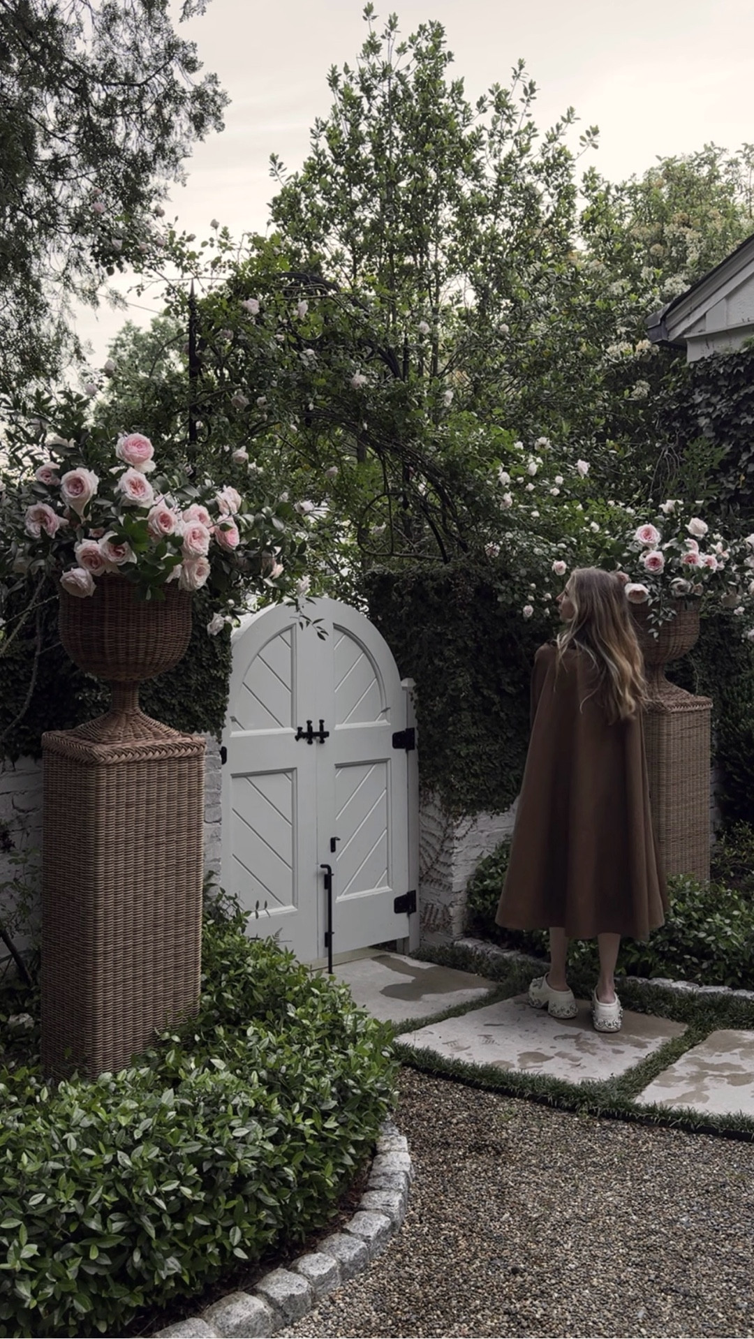 Urns and pedestals make the front courtyard! Love this gardening look too 🦢 

#LTKHome #LTKmomlife #LTKmorningroutine