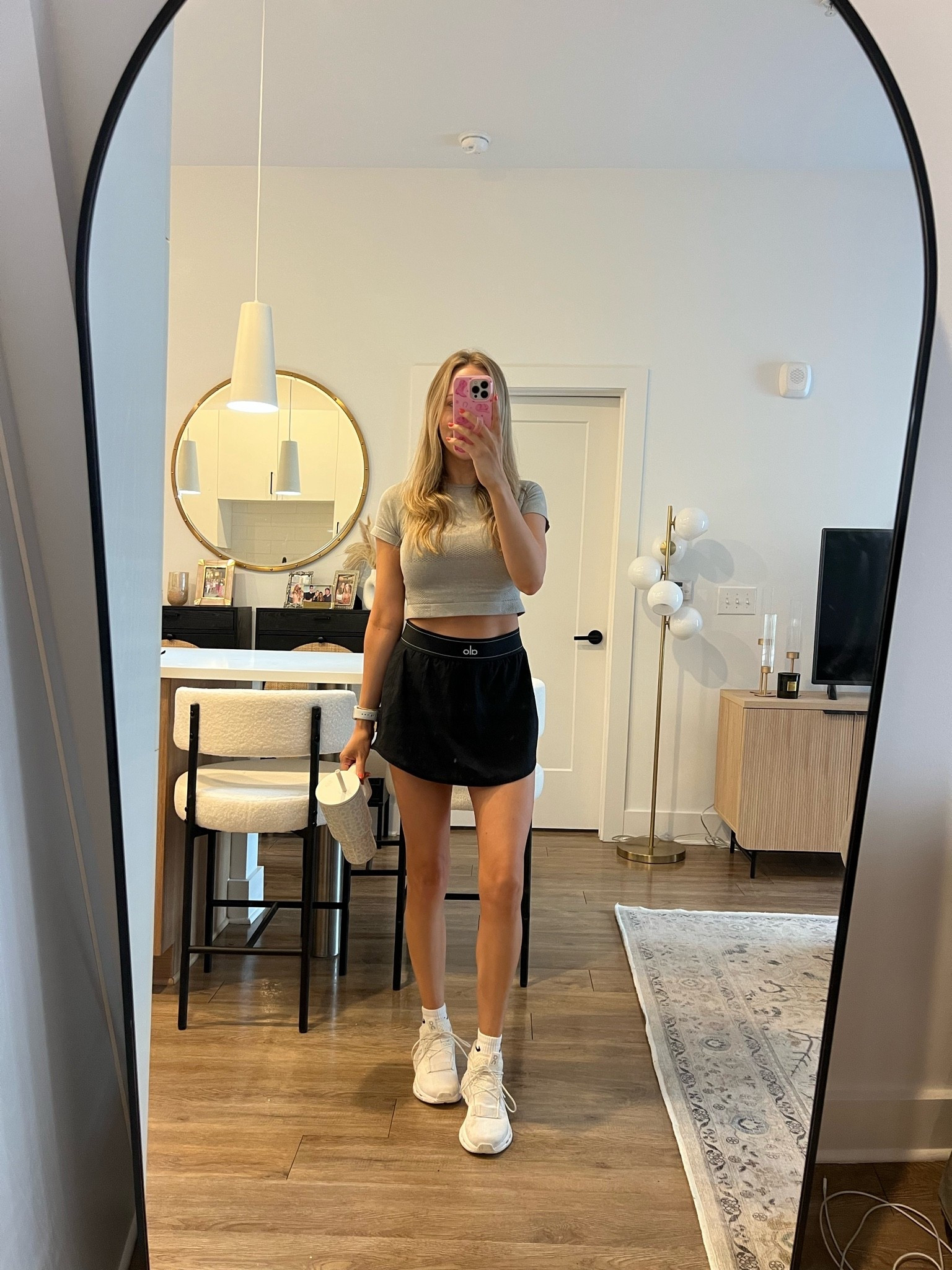 Black alo skirt, grey workout crop top, nike socks, simply modern tumbler

#LTKootd #LTKgrwm #LTKdayinmylife