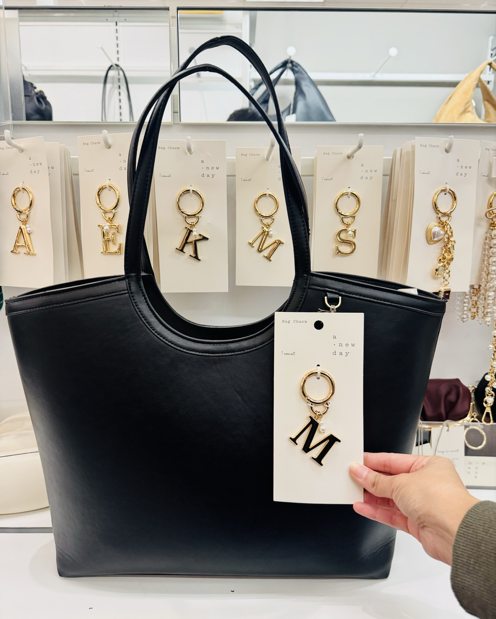 When a bag is functional and adorable, it’s an instant add-to-cart moment.
Add the sweetest little bag charm, and I’m obsessed with how effortlessly it pulls an outfit together. Wear it for errands, mom life, work, or weekend runs,  it’s that perfect mix of stylish, roomy, and affordable. If you’re a girl who loves simple looks with a pop of personality, this is the tote you’ll reach for every single day. 💕

#LTKFindsUnder50 #LTKselfcare