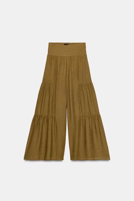 Model height: 176 cmHigh-waist trousers with an elasticated shirred back. Wide-leg design with si... | Zara UK