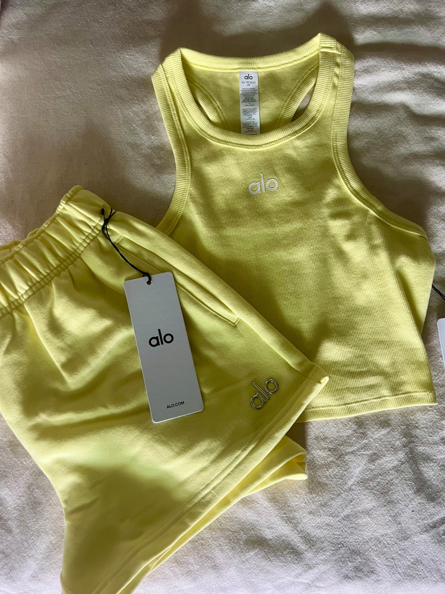 Planning to live in the new alo sunshine hue all Spring & Summer☀️ Wearing xs in both - tank is tts/could’ve sized down to xxs in the shorts for a tighter fit

#LTKActive #LTKSeasonal #LTKootd
