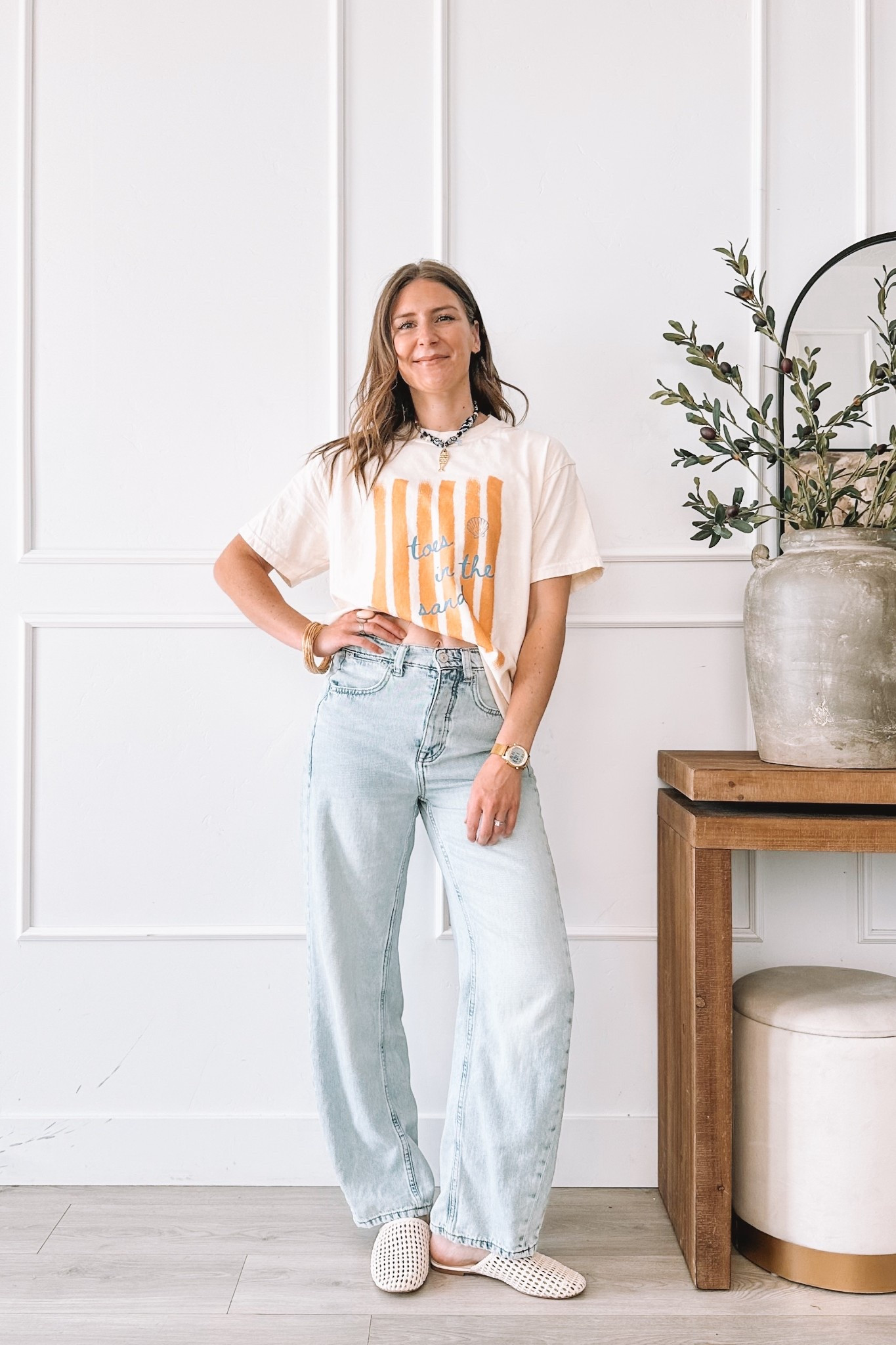 Toes in the sand graphic tee with light wash wide leg jeans, woven mules and layered necklaces. Wearing a large in the tee. I am 5’8” and typically a small so size up at least two sizes for this look. All pieces linked here.

#LTKmomlife #LTKootd #LTKgrwm