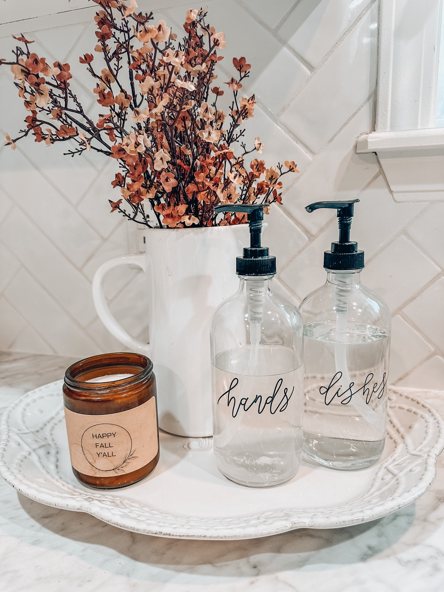 Fall decor!! Amazon home finds! Love the fall faux florals, Hand and dish soap dispensers, and the white pitcher I found on Amazon! Happy fall y’all Candle is the best smelling candle from a small shop on Etsy!  Linked below! 

Fall home decor. Fall decorating. Kitchen must haves. Kitchen essentials. Home decor. Halloween decor. Interior design. Kitchen decor. Autumn 

#LTKhome #LTKHalloween #LTKSeasonal