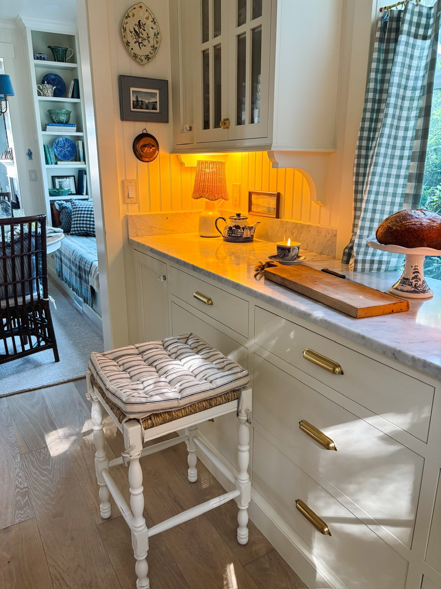 Cozy cottage kitchen ✨ counter stool, lamp with woven shade, gingham cafe curtains