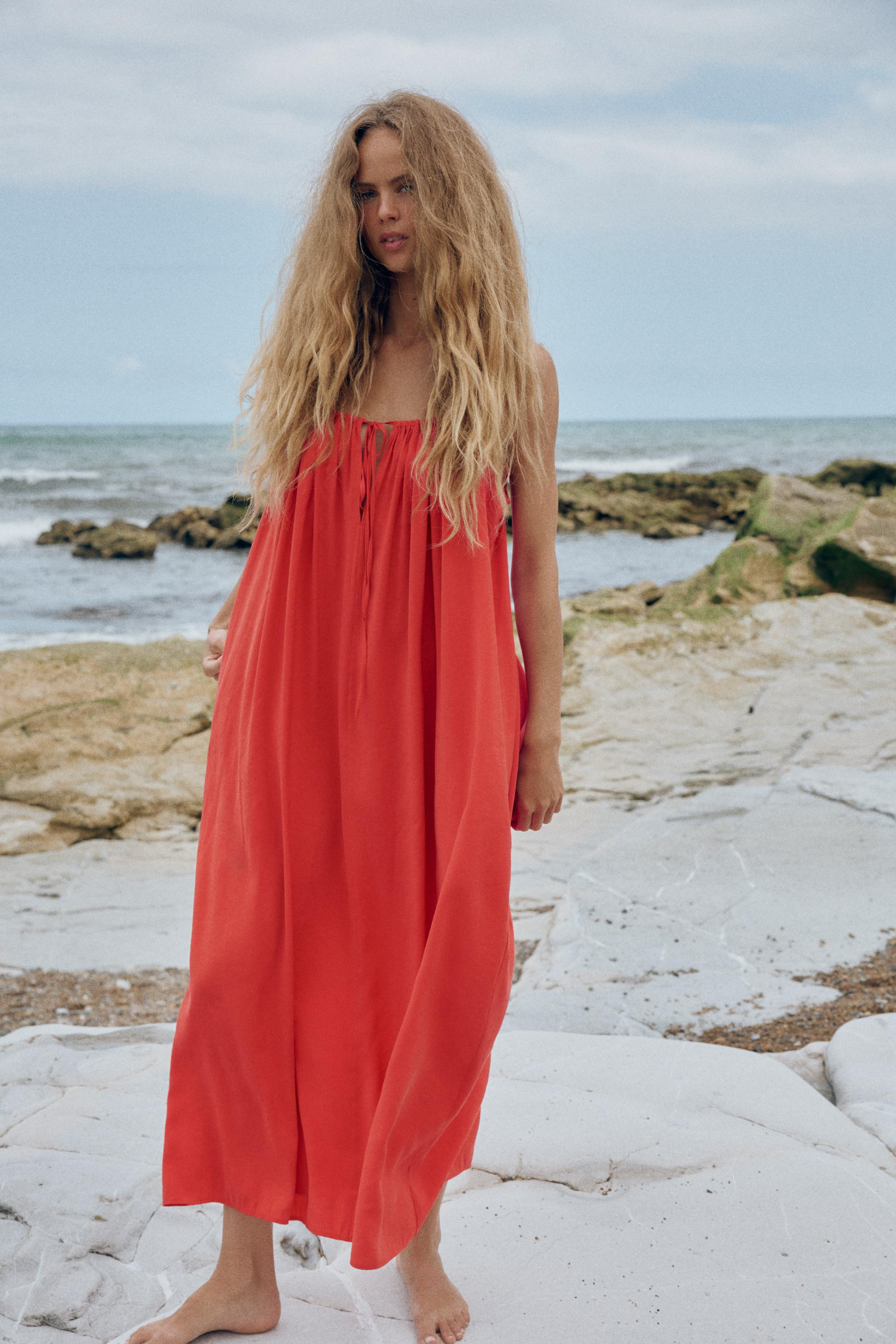 Model height: 178 cmMidi dress made from flowing fabric. V-neck with thin adjustable straps. Feat... | Zara UK