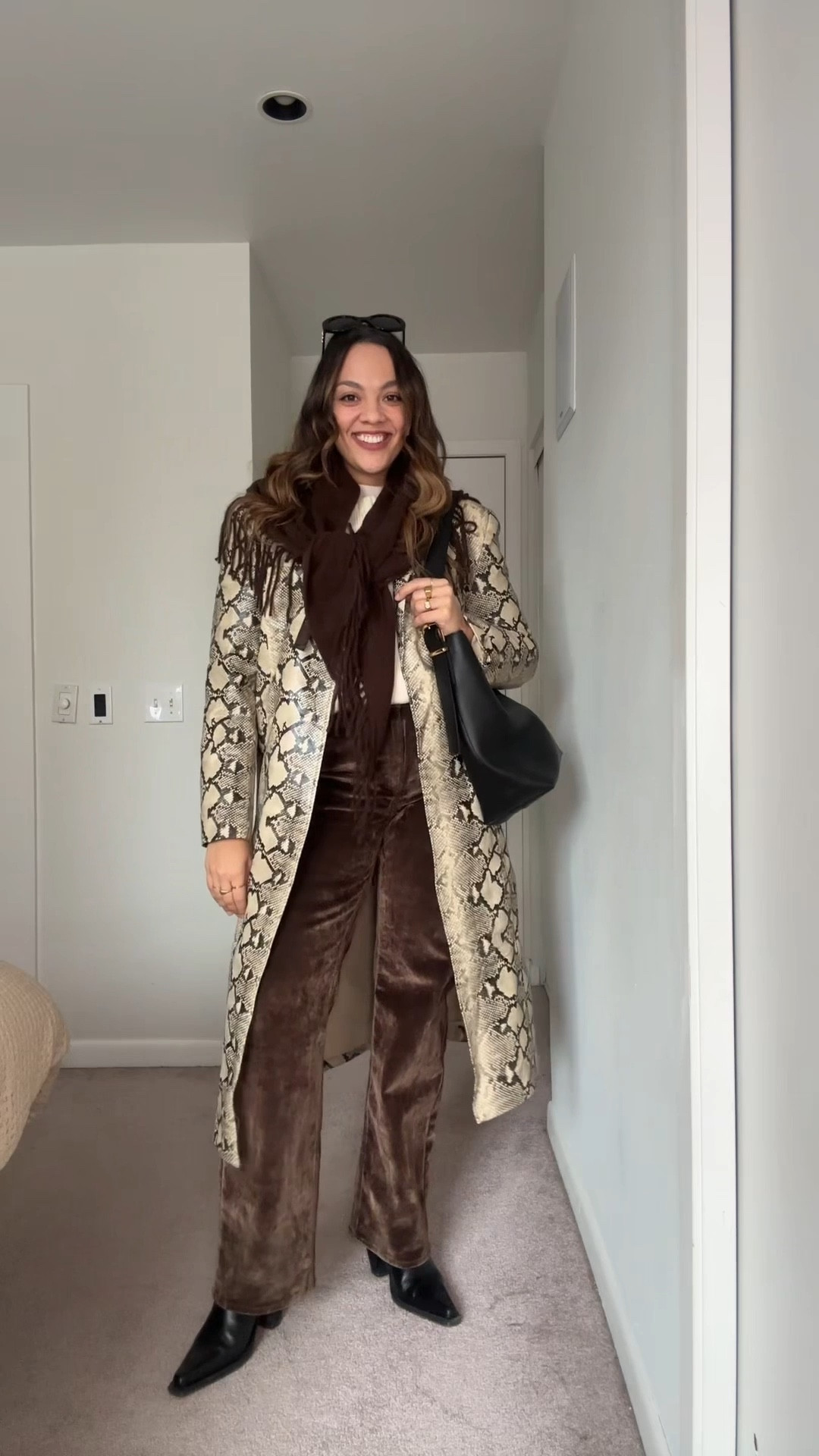 -Abercrombie high rise brown flocked jeans, I have a size 29 long. 
-Revolve snake print jacket, I have a large. 
-Gap cotton cream sweater, I have a large. 
-Madewell black leather bucket tote. 
-Celine Triomphe sunglasses  

#LTKcanada #LTKwinter #LTKstyletip