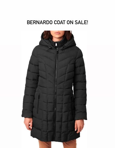Bernardo coat. These have a feline silhouette. Run more fitted so size up if you want to layer. 

Mine is from last year but this length is very similar. I have the small  