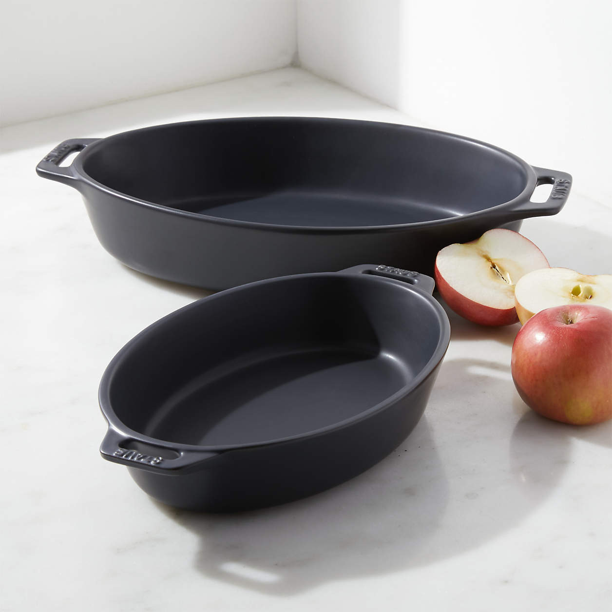 Staub White 2-Piece Oval Baker Set + Reviews | Crate & Barrel | Crate & Barrel