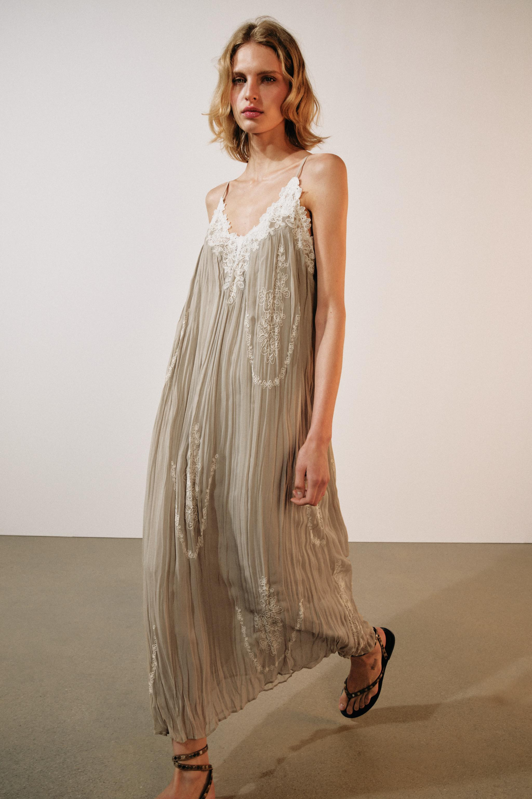 ZARA WOMAN COLLECTIONDress made from a viscose blend yarn. Featuring a V-neck and slim adjustable... | Zara UK