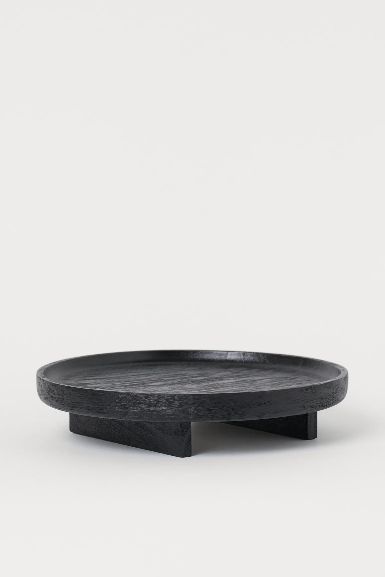 Round tray in mango wood with a low rim and rectangular feet. Height approx. 2 1/4 in. Diameter 1... | H&M (US)