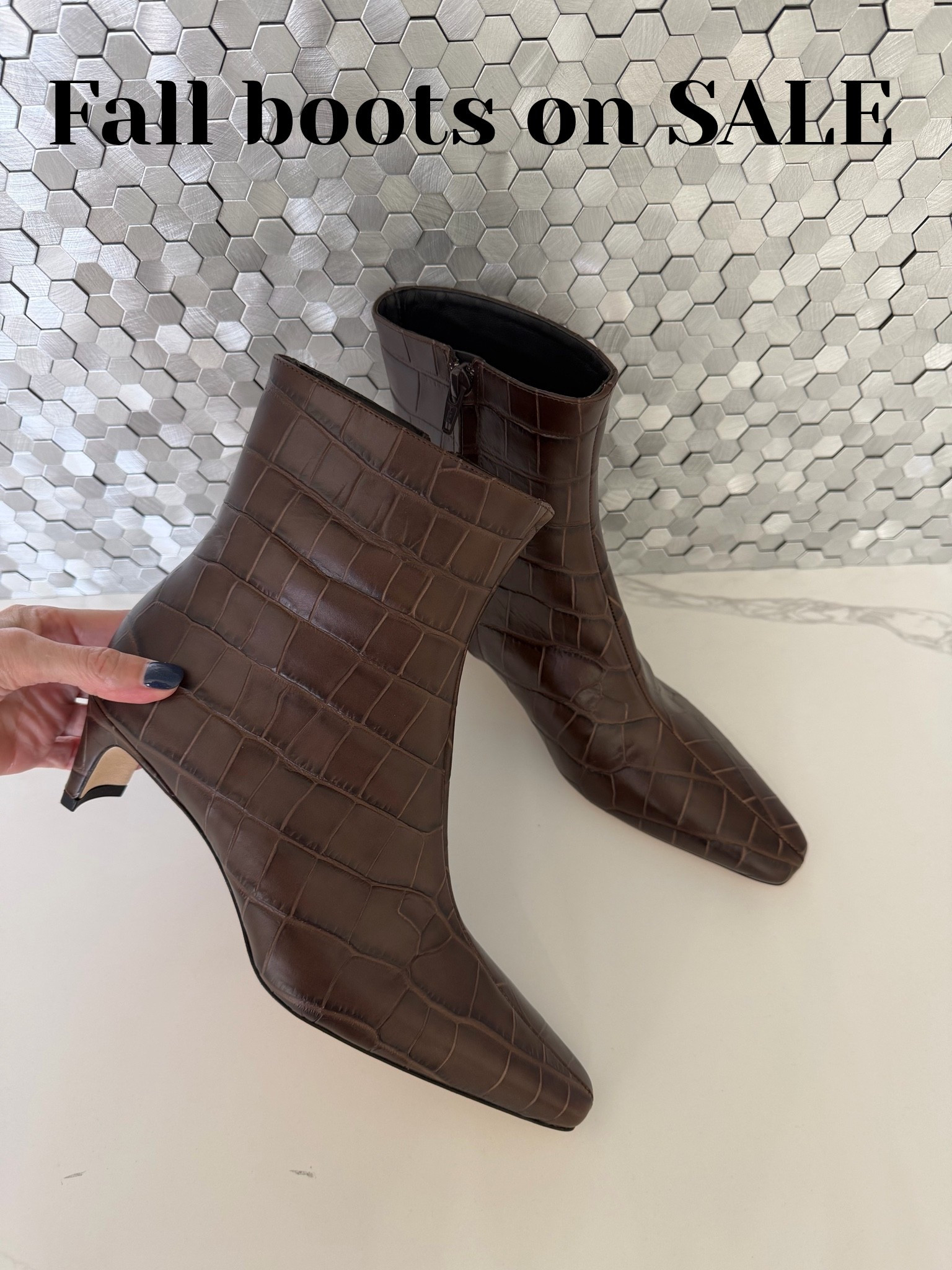 The perfect fall boots are ON SALE! The rich brown croc texture, pointed toe, and walkable kitten heel make these ankle boots look far more expensive than they are. #LTKSaleAlert #LTKShoeCrush #LTKOver40
 

 