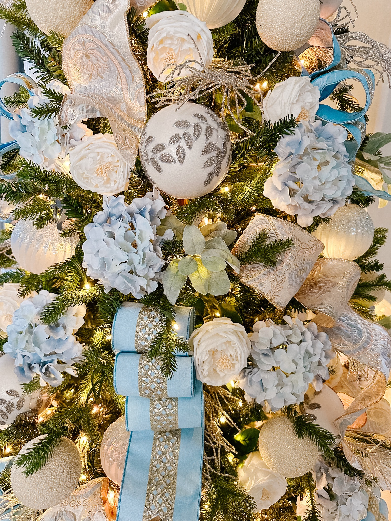 a very Bridgerton inspired Christmas - The Bridgerton family tree. I stuck with the Bridgerton blues they always wear and added the beaded feathers for the quills that Lady Whistledown uses. 

#LTKHoliday #LTKSeasonal #LTKHome