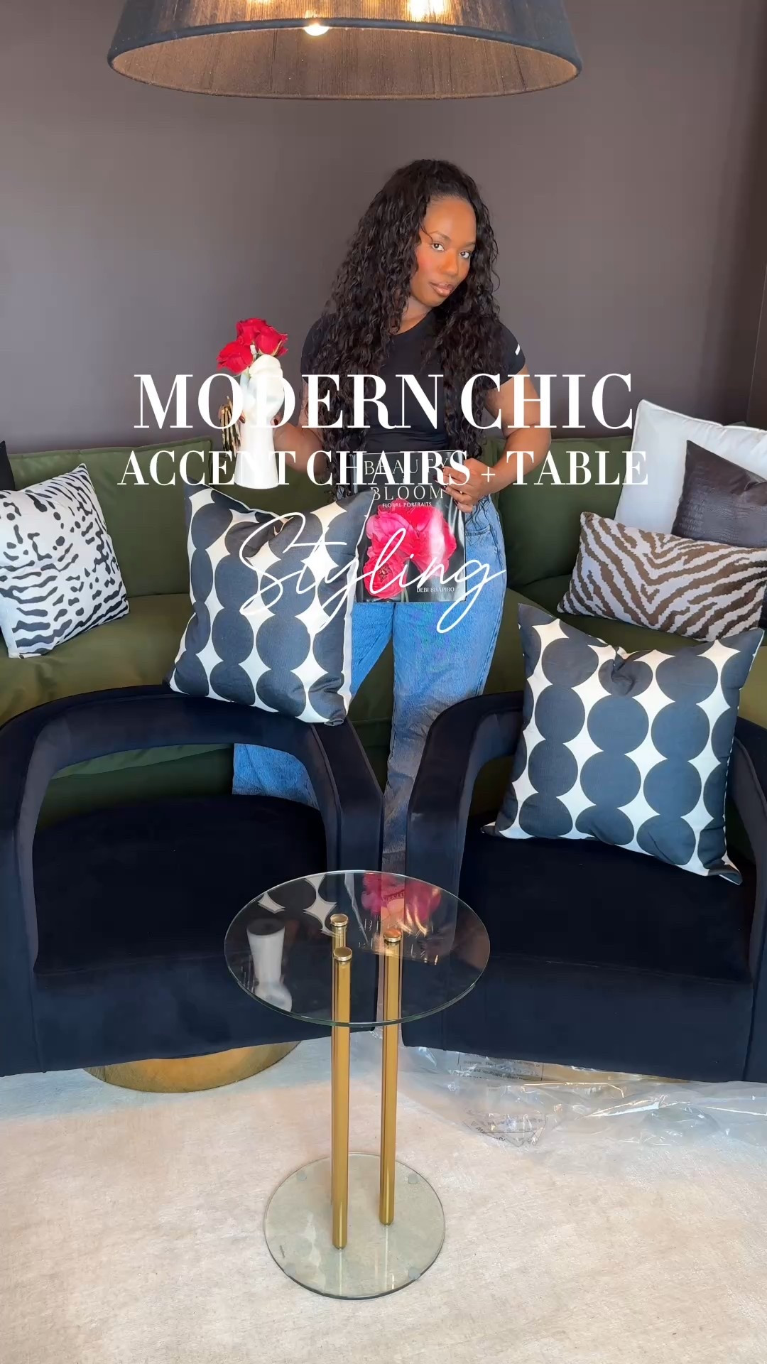 Find your place to bloom 🌹❤️ 

✨Part 3 of my living room makeover modern chic with a hint of art deco vibes. the only thing left are the walls (and i cannot wait to show y’all what i’m doing for them in part 4)! plus, i’ll be restyling the coffee table & tv board area.

✨These black and gold accent chairs are gorgeous and the perfect size! Comes in a set of two or single for under $500!

✨All my pillows used are shared on the full list dm button 

✨Y’all, I’m really trying to use real flowers and plants this year😅Fresh flowers just do something for your space!

✨The hand vase is from world market, but I linked even better ones on my storefront. I’m swapping for the cute feminine hand vase I shared on my list.

❤️The glass table is $50 at @homegoods , but I found similar ones and added them to my full living room list. I love this one in the video because of the three gold legs in the middle—it looks so stylish. Definitely recommend going in store to find it!

What’s a must-have in a stylish living room? 👇🏾

Options:
1️⃣ Statement chairs
2️⃣ A unique coffee table
3️⃣ Bold wall art
4️⃣ Fresh flowers & plants

#homedecor #modernchic #interiordesign #artdeco #livingroomstyle #homevibes #homestyling #blackhomecreator #homegoods #neutraldecor #homeaesthetic #chicdecor #amazonfinds #amazonhome #accentchair #accentswivelchairs

#LTKStyleTip #LTKHome #LTKFamily